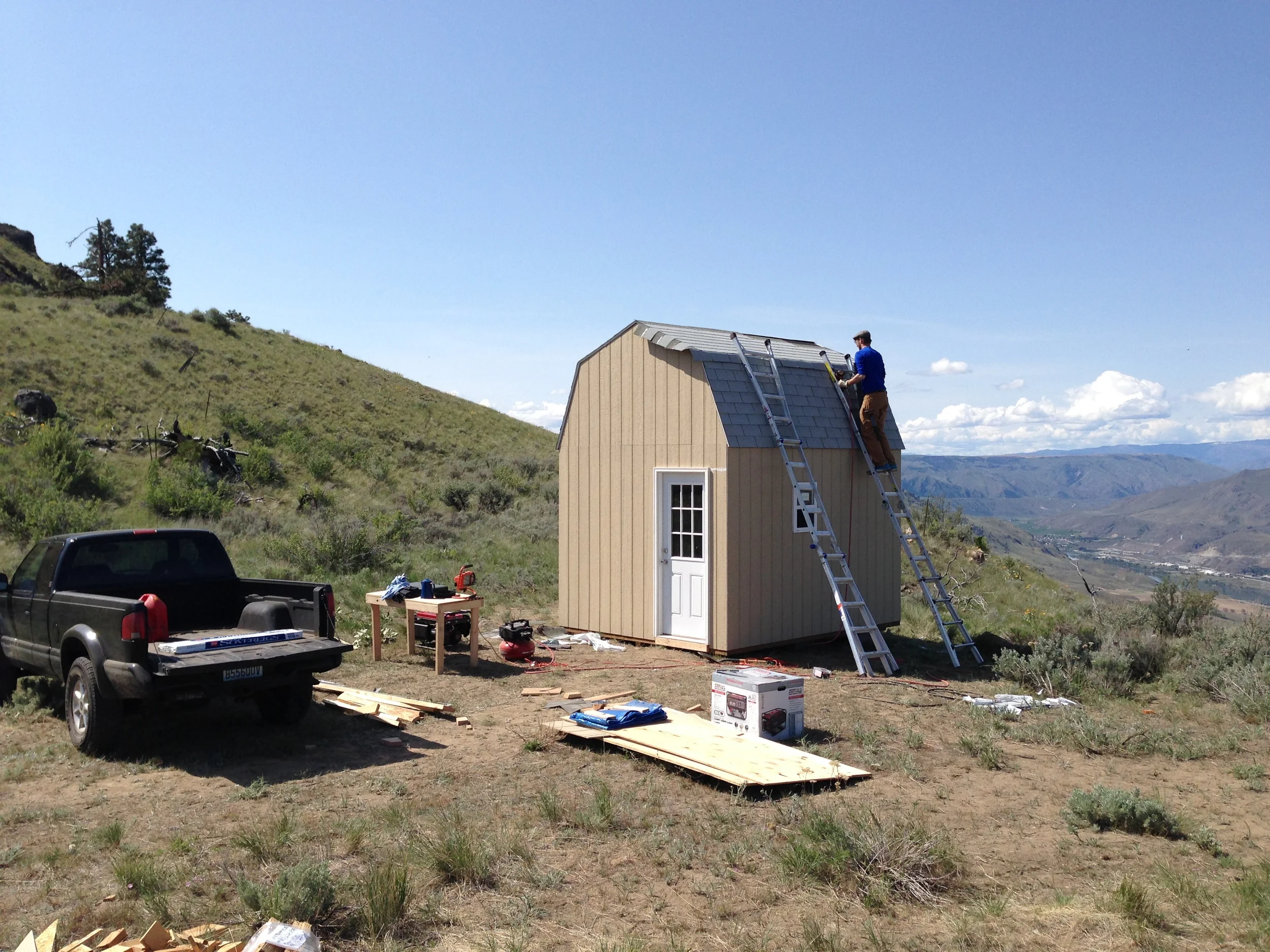 Two ladders made all the difference for the shingling process. I was envious of single-pitch roofs that slope more gently and allow for staging stacks of shingles without them sliding off.