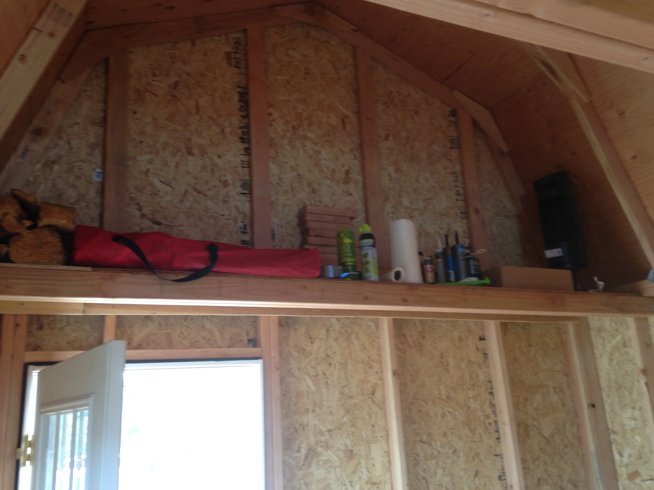 A hefty shelf over the door that keeps things up and out of the way.