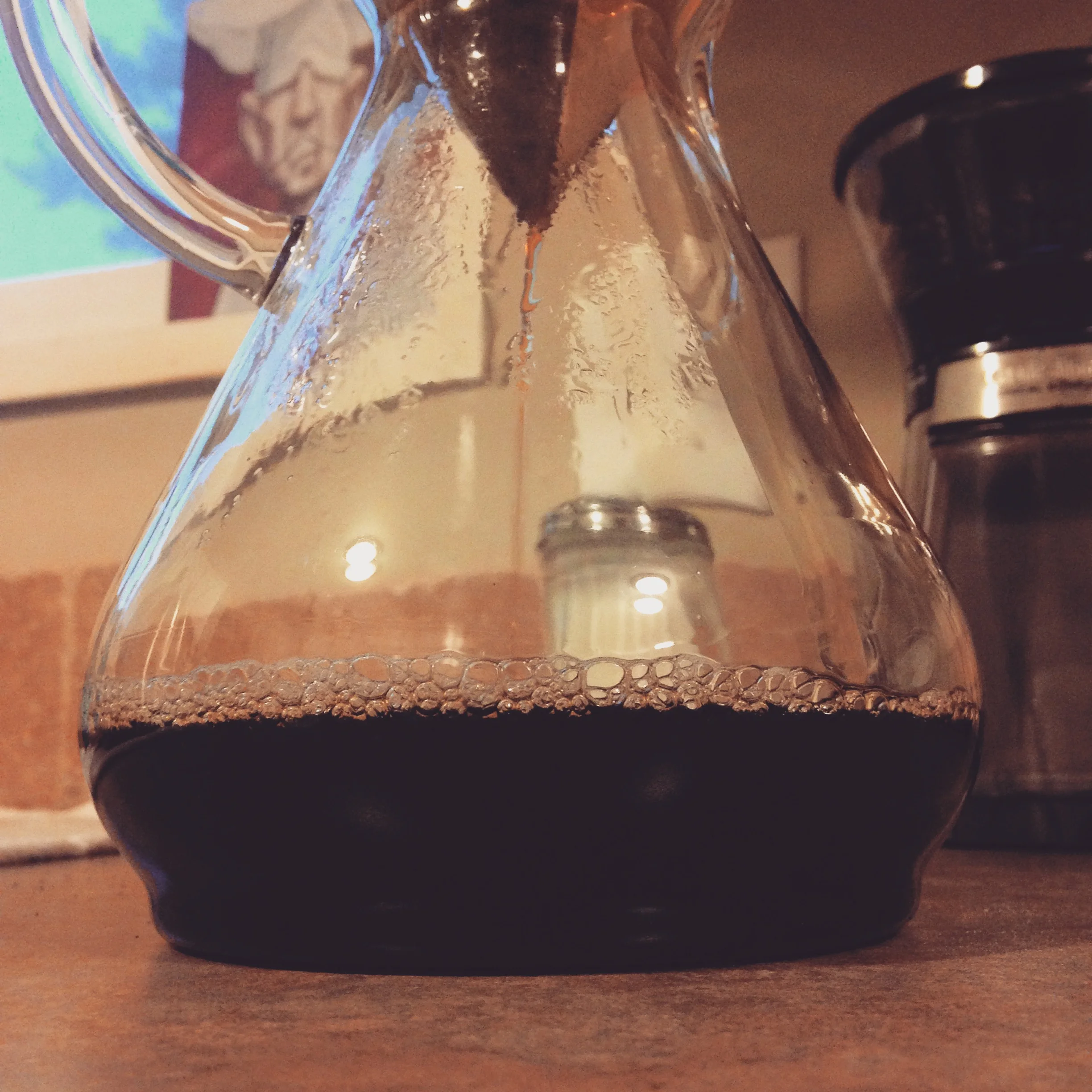 My morning ritual involves this simple brewing apparatus, watched over by a fantastically French-looking chef.