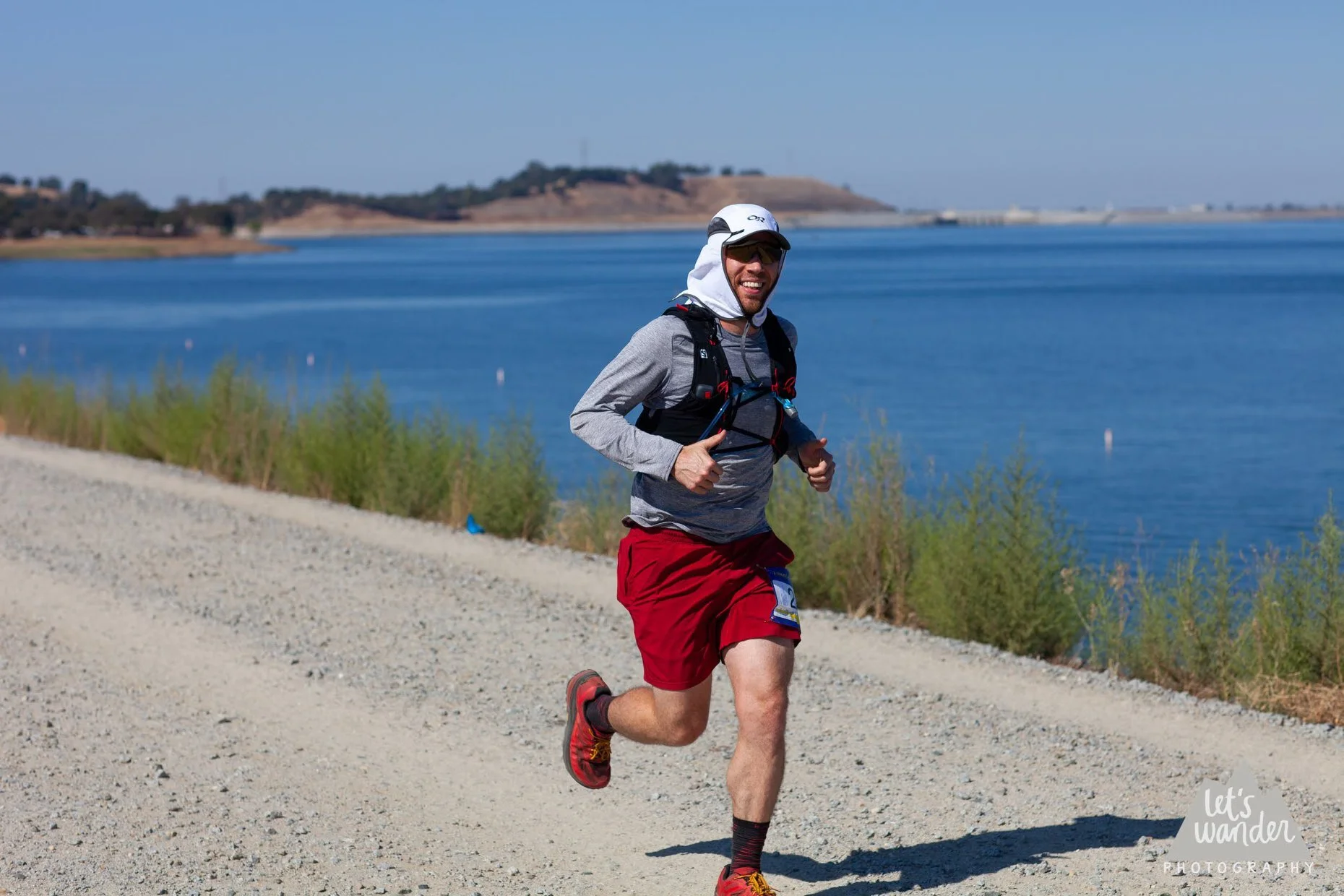 This is me, somewhere in the first 8 miles, running around Folsom Lake (pictured in the background).