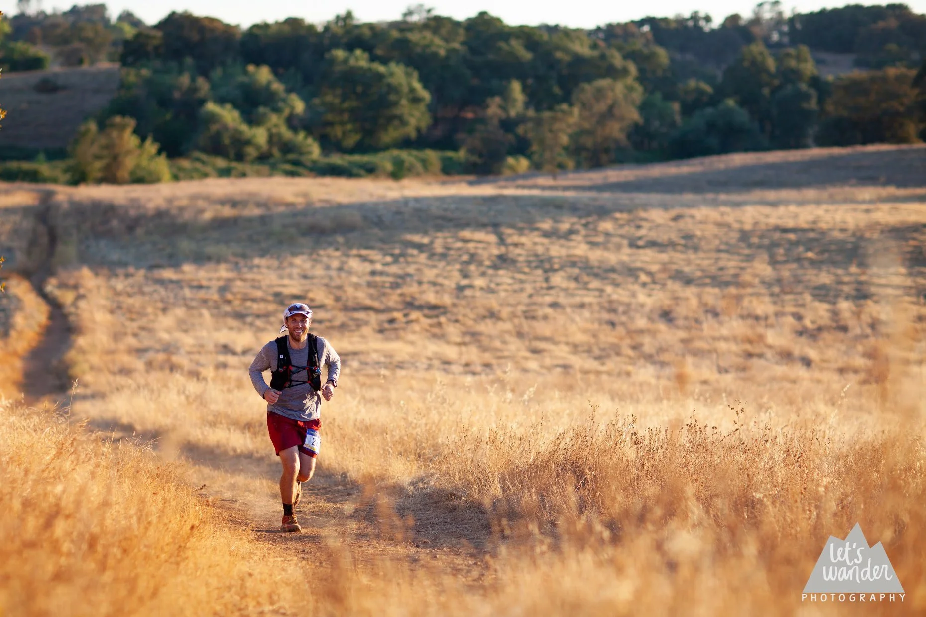 This is me, stoked to see a course photographer, realizing that I’m about to pull in to the aid station in Cool, California.