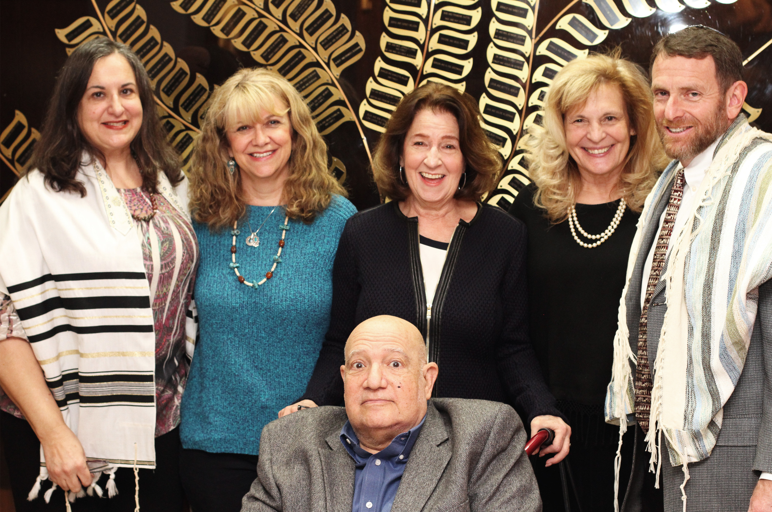 Temple Emanu-El Staff pose for a picture for Olga and Bob Strauss