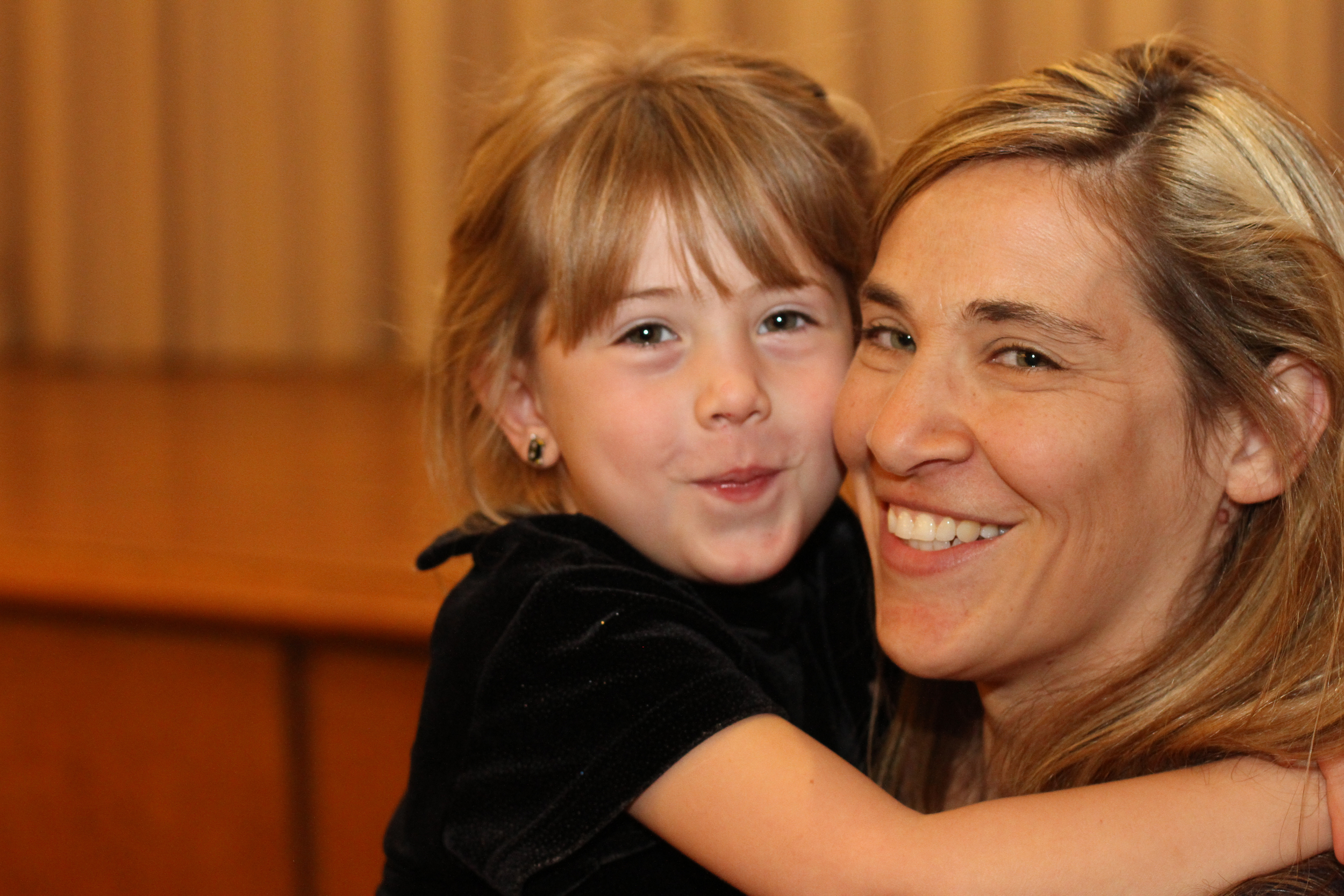 Mother and daughter smiling at their Tucson preschool.