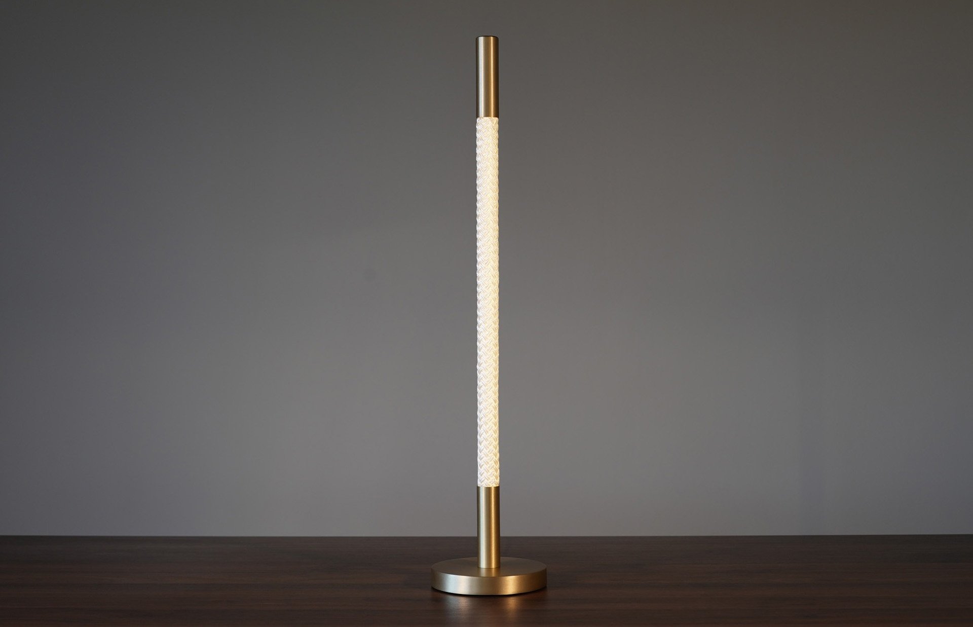 24inReedTableLamp-SatinBrass-Ambient-On-Front-9075.jpg