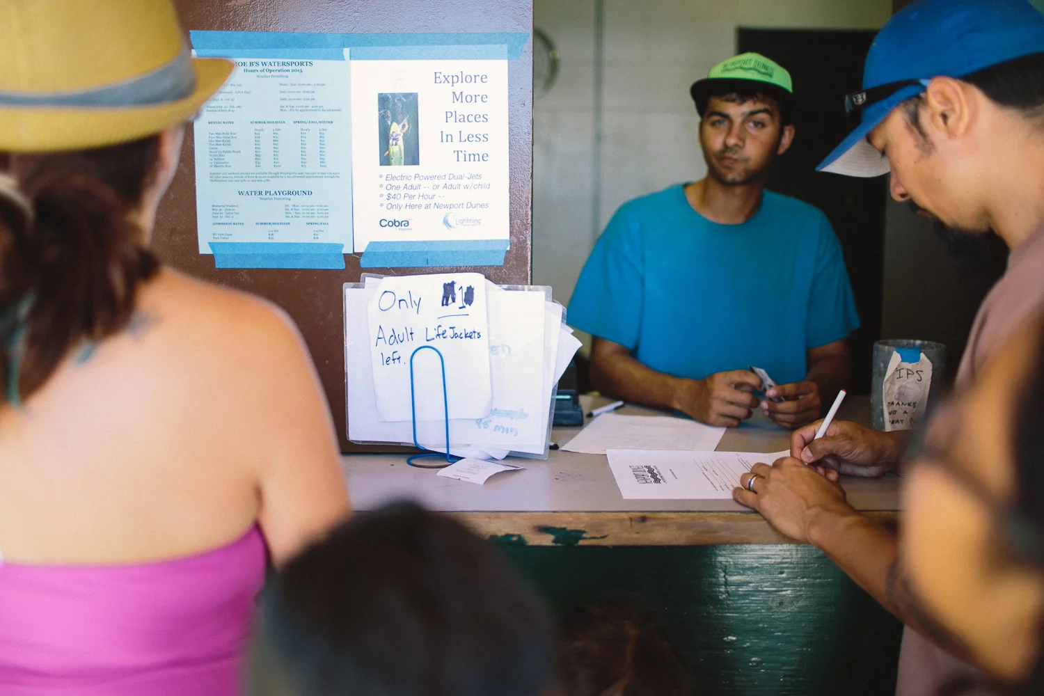 I like how people react in front of the camera... like many photographers, I also act strange when a camera is pointed in my direction and make strange faces as this young lad taking my credit card information for the kayak rental. 