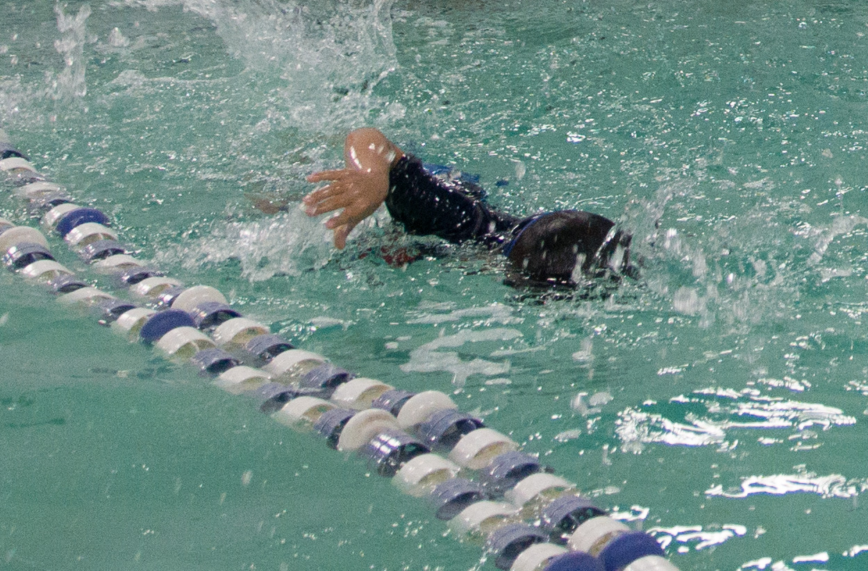 Did a terrific job locking focus on a moving subject indoors (granted my son is not a fast swimmer but you get the gist). 
