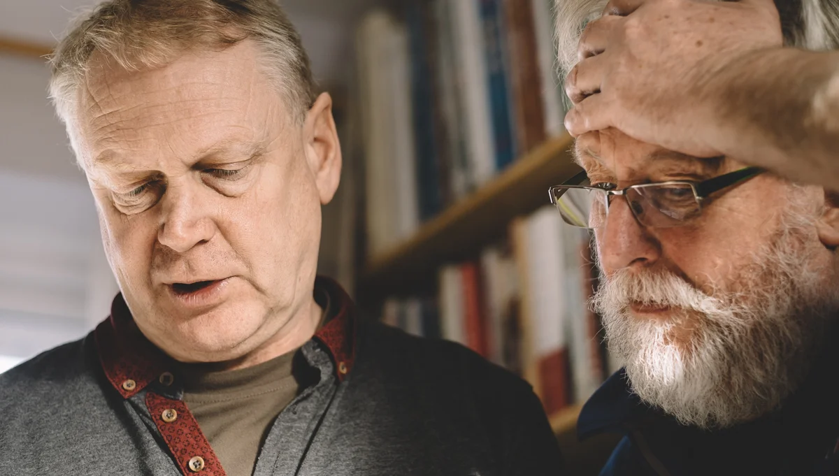 Tim Collier and Emyr Young browsing Tim's extensive Wildlife book collection. Image by Brian Carroll