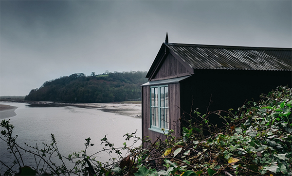 The Dylan Thomas writing shed overlooking the scenic estuary in Laugharne.