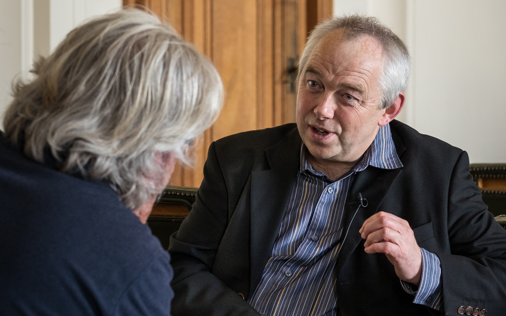 Will Troughton, Curator of the Philip Jones Griffiths Exhibition at the National Library of Wales.Image © Glyn Shakeshaft
