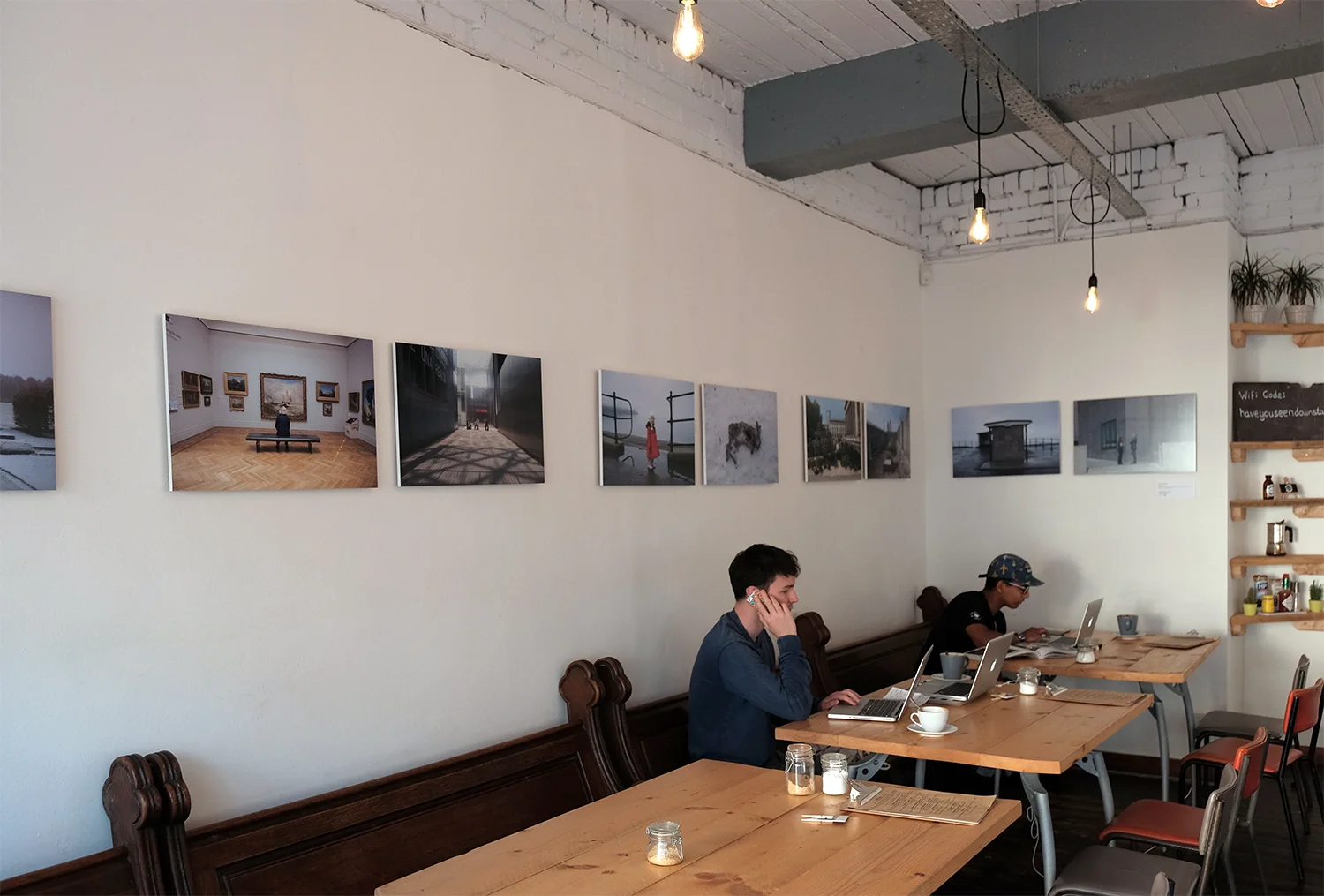 Work by Eleri Griffiths on the walls at Littleman Coffee in Cardiff