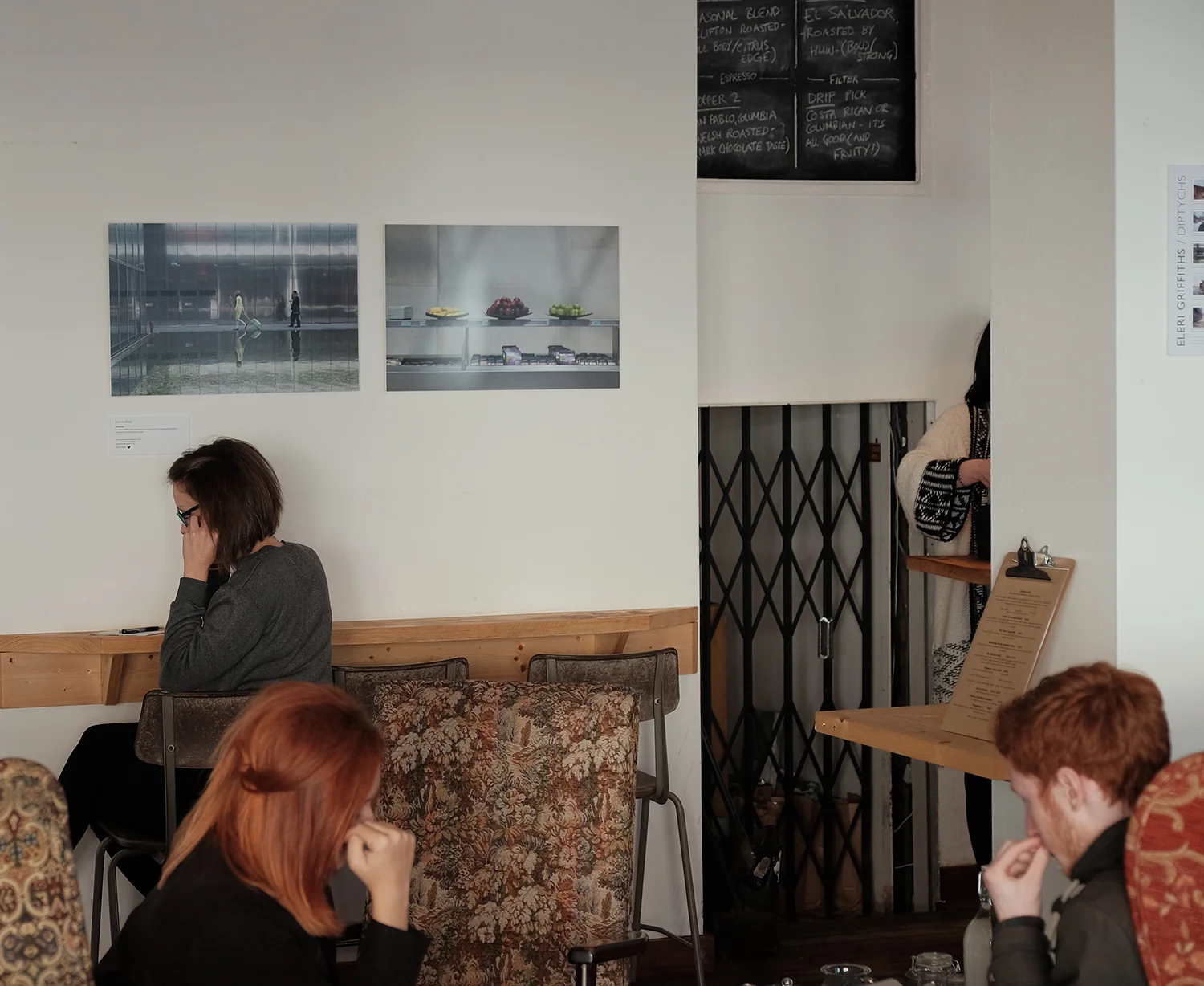 Work by Eleri Griffiths on the walls at Littleman Coffee in Cardiff