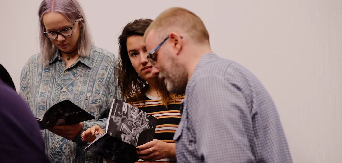 Marc Vallée showing his self-published Zines to photojournalism students at the University of South Wales