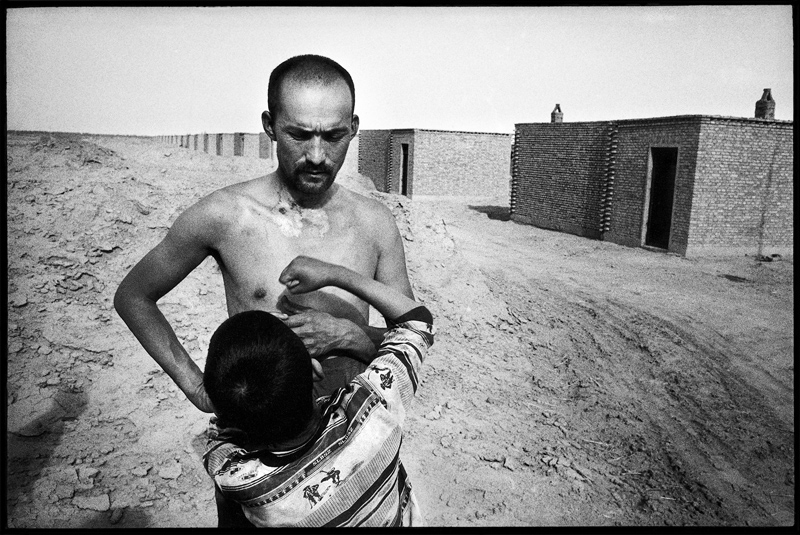 Uighur Father and son, Chulan resettlement community, China