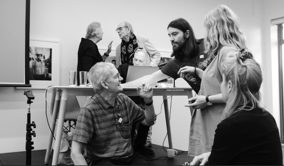 Conversations between presentation sessions at The Martin Parr Foundation. © Brian Carroll