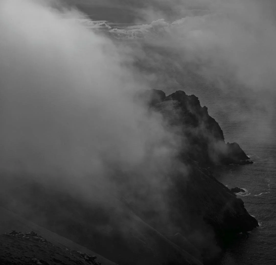 Dùn and Ruabhal in the mist. Cover image for Alex's new book 'St Kilda: The Silent Islands'© Alex Boyd