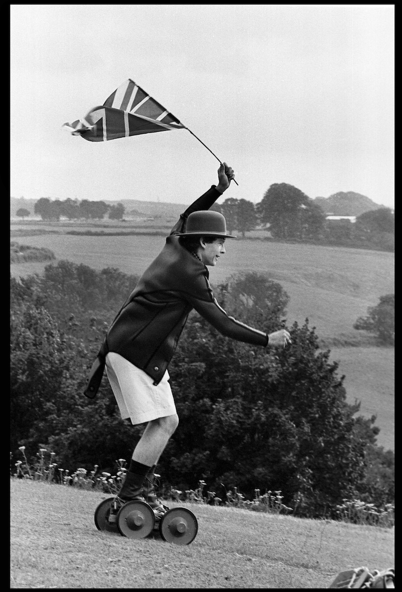 Crispin Balfour rolling along at the Dangerous Sports Club Tea party, 1981.