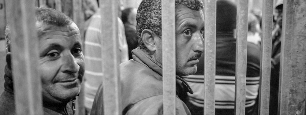 Bethlehem, Palestine. Workers queue to gain entry into Israel each day for work. Nearly 3000 men and 250 women start queuing from 4am each day in order to get through the Israeli checkpoints in time for work. Each day some are turned away. © Haydn D