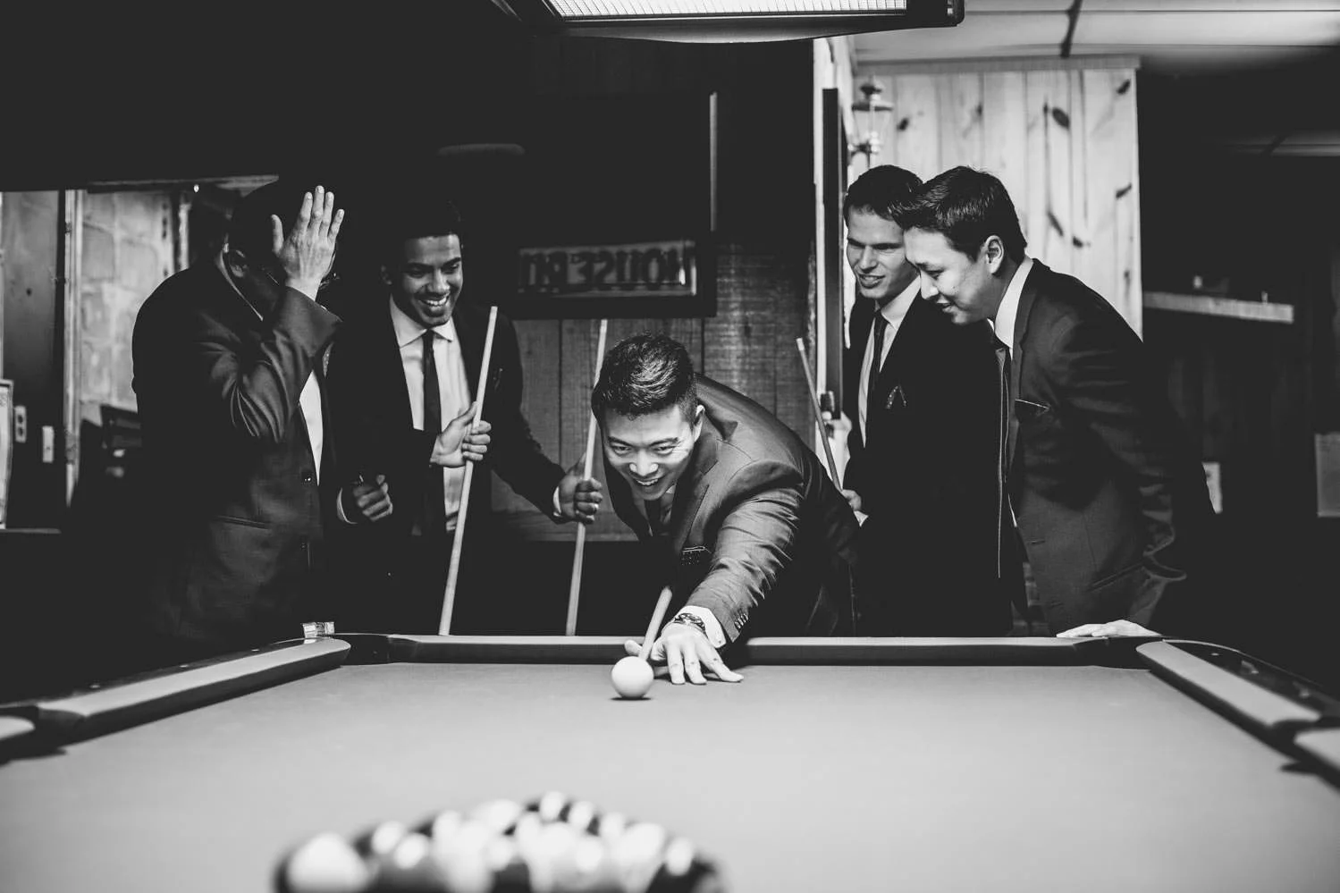groomsmen-playing-game-of-billiards.jpg