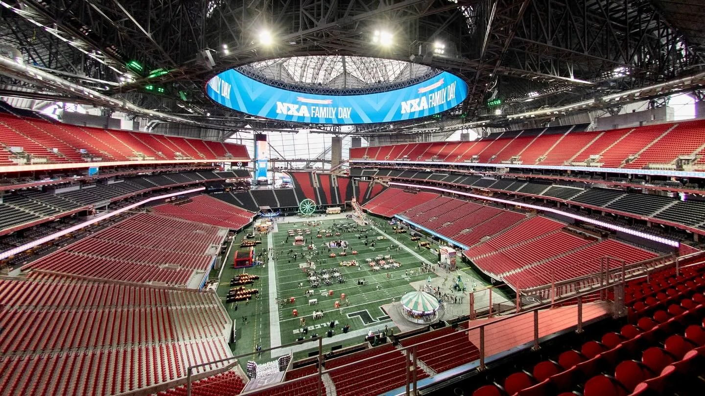 This company knew how to throw a party with wow factor! Last week we photo&rsquo;ed this carnival themed event (with rides!) for 800 guests on the field at Mercedes-Benz Stadium. Cool overhead view!