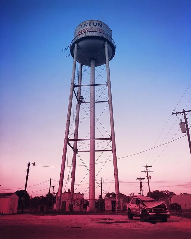 On this Water Tower Wednesday behold this tri-colored towering tower tower over this trashed truck. 😮🤭#WhatsWithTheAlliteration #WaterTower #Wednesday #Truck #Tricolor #RedWhiteAndBlue #NewMexico #Neato #ShotOniPhone #Alliteration #Hashtag