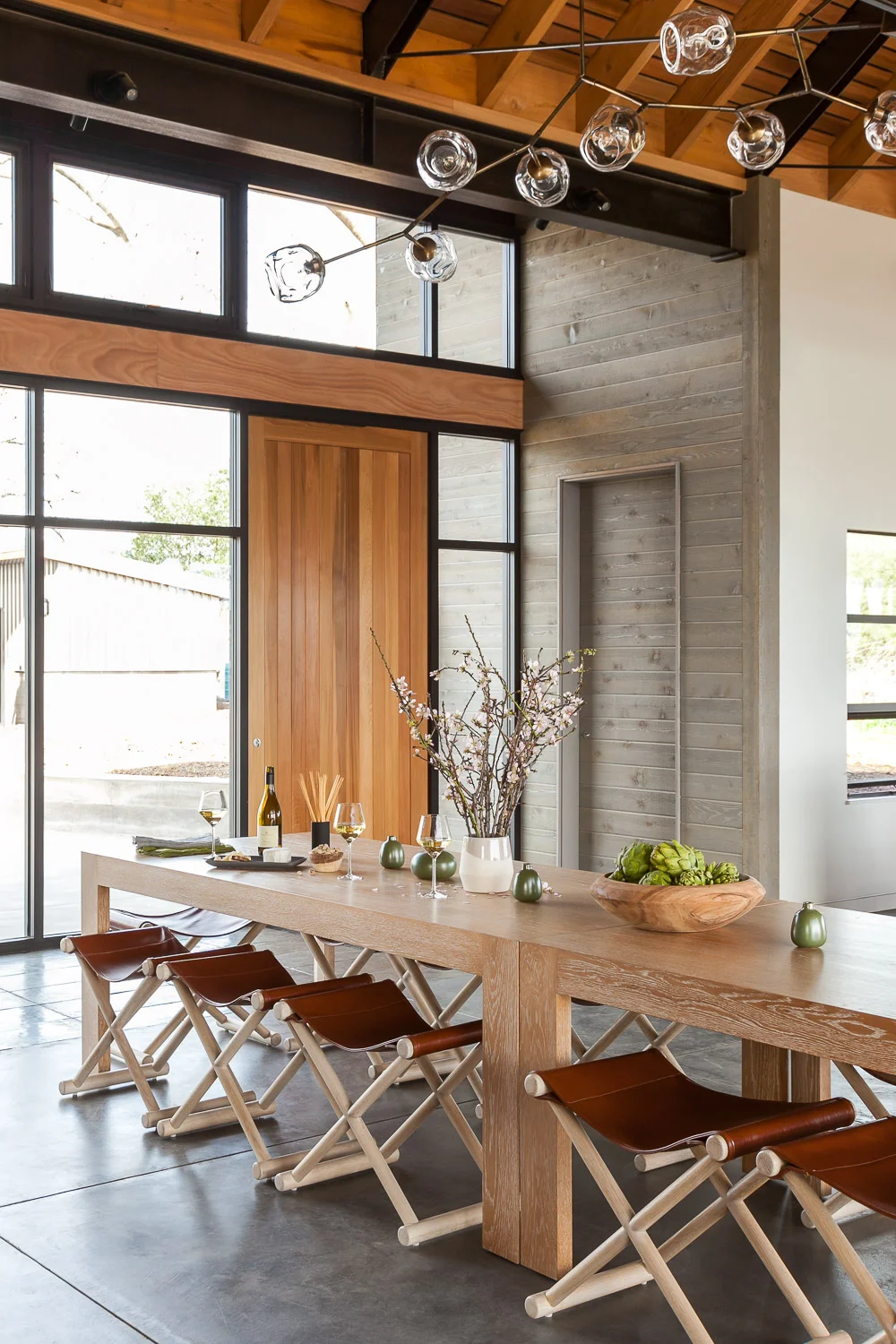 The custom-made communal table invites conversation while wine tasting and noshing.