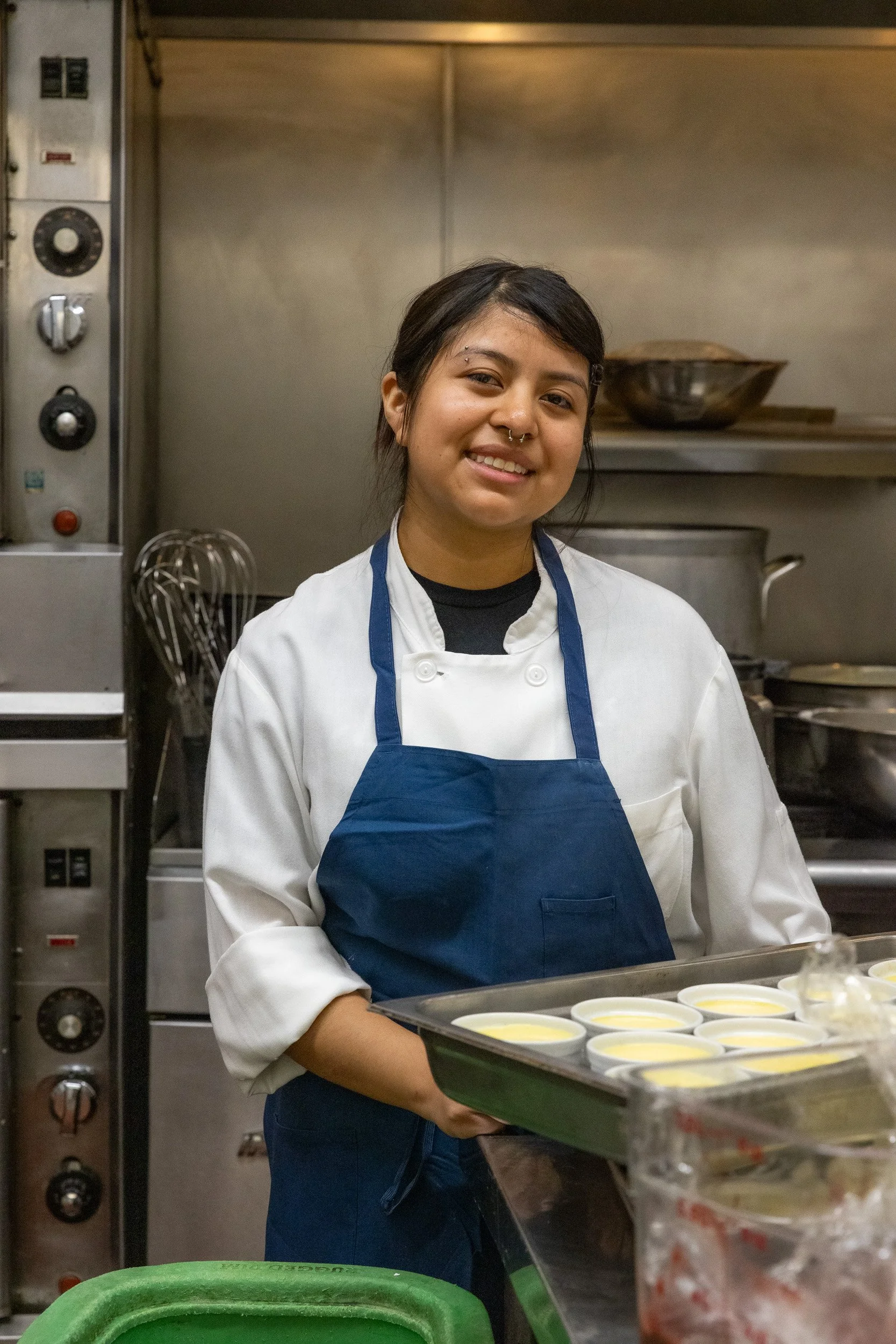 Student posing with food in Sprouts Chef Training
