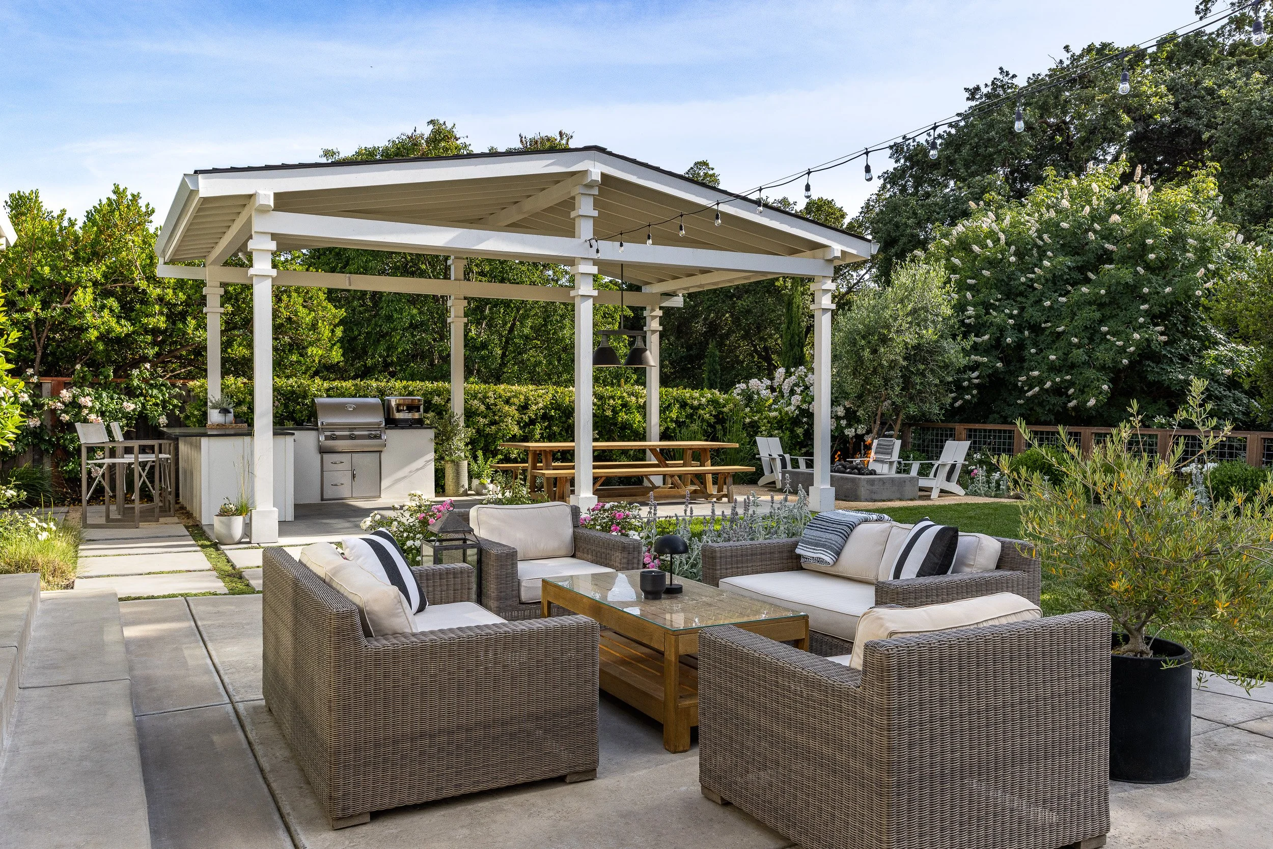 Gazebo with picnic table and seating by Lazar Landscape Design and Construction