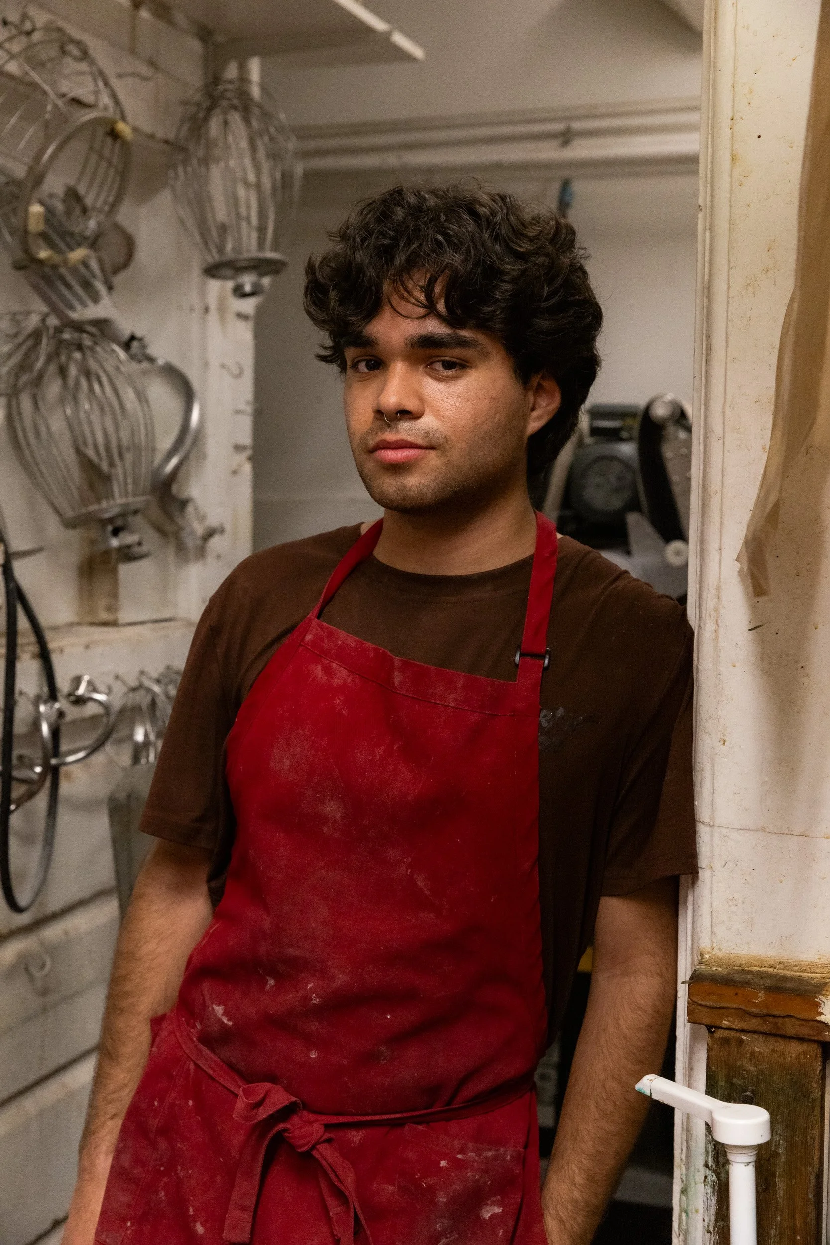 Student in red apron