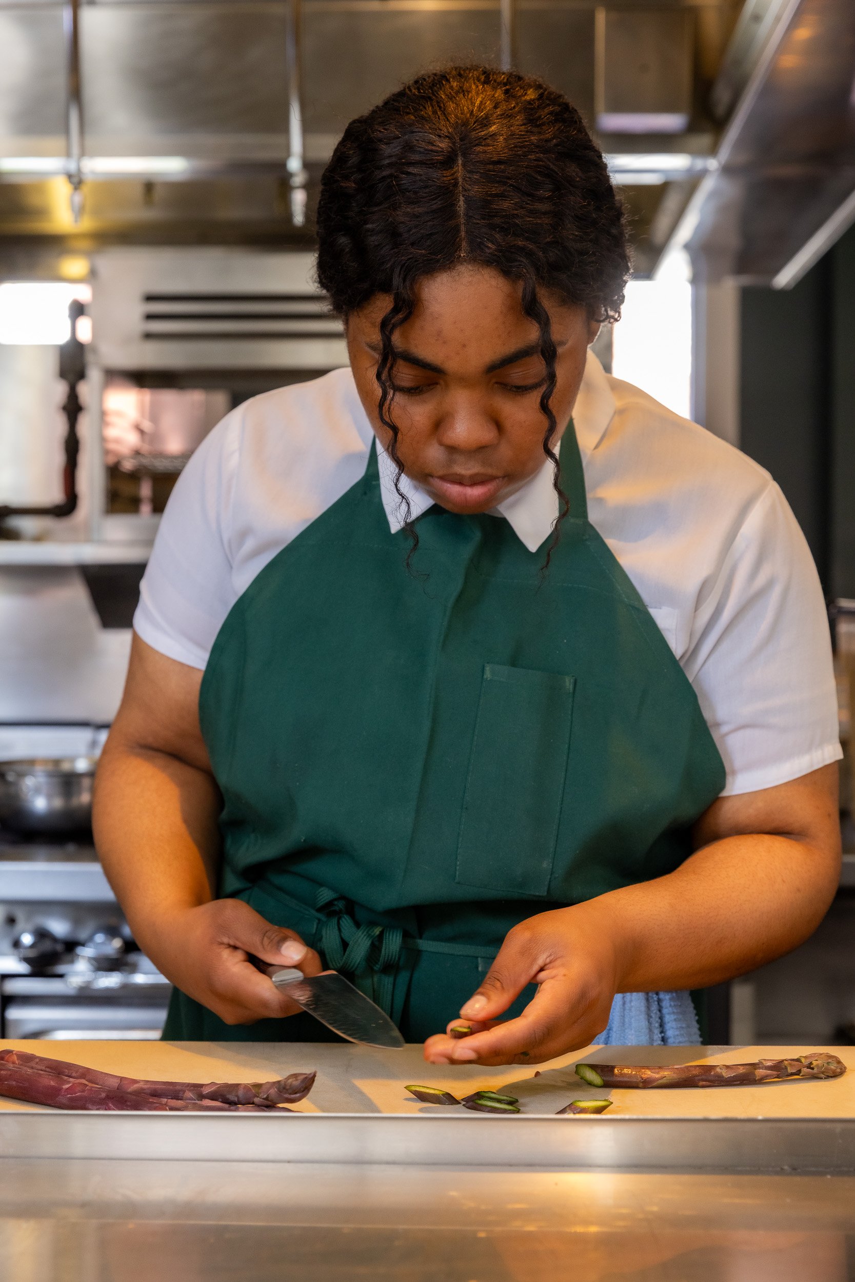 Female student dicing food