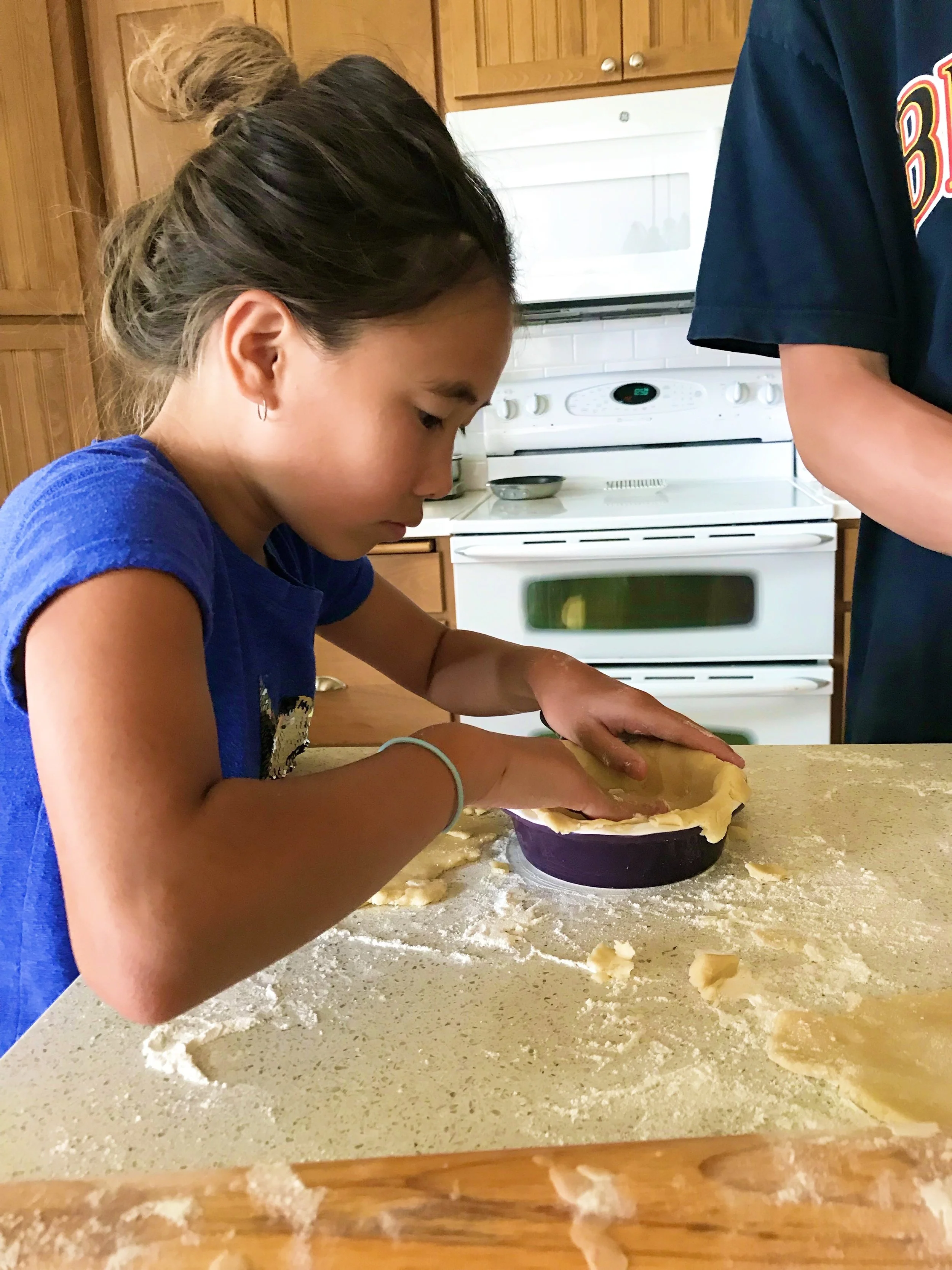 Addie is BEST friends with Trey. They literally PLAY together every.single.day. On this day, we picked late raspberries and blueberries in the morning and then in the afternoon, they made mini pies. 