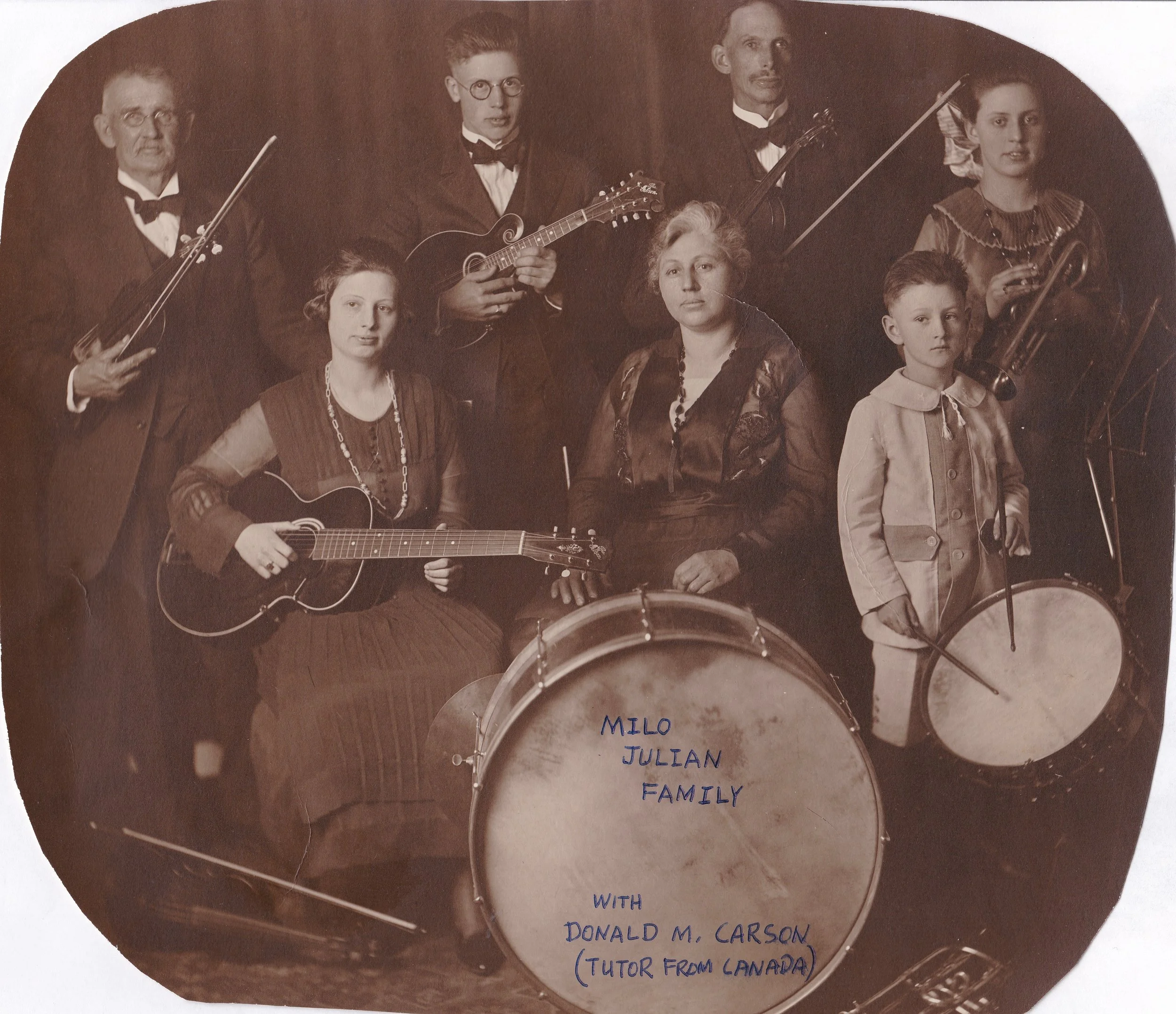 The Milo Julian Family Orchestra. circa 1920 Please note that I am very grateful to have this photo, but also sad that my father in law trimmed the corners and wrote on it with a ball point pen. Please do not do anything to an original photo that cannot be undone.