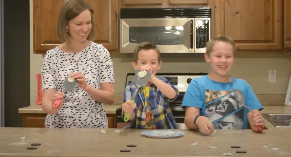 Brittany believes there are times when play with your food should be encouraged! Here she is in competition with her nephews to see who can land the cream of an Oreo nearest its cookie!