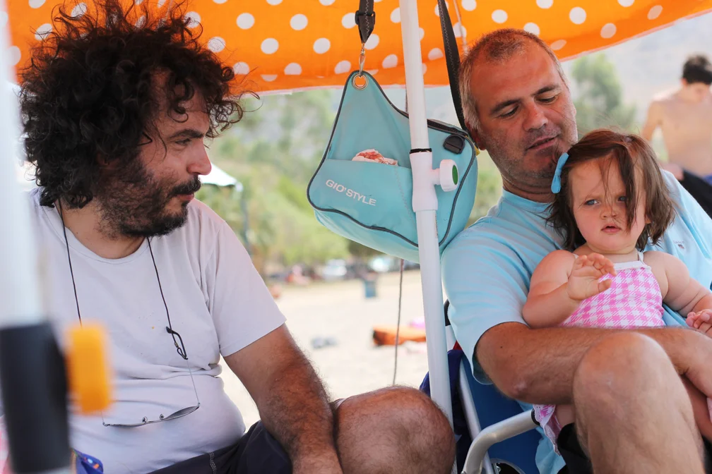 Alice sustained her first injury sitting at the water's edge where for the local honeybees go to pick up salt. A nasty sting left her hand swollen for days. Luckily, other than the initial first few minutes of pain, it didn't seem to bother her one bit. Especially since she got some extra love from everyone, especially her uncles Kostis and Costas. Which was perfect, because she seemed to enjoy their company the most.