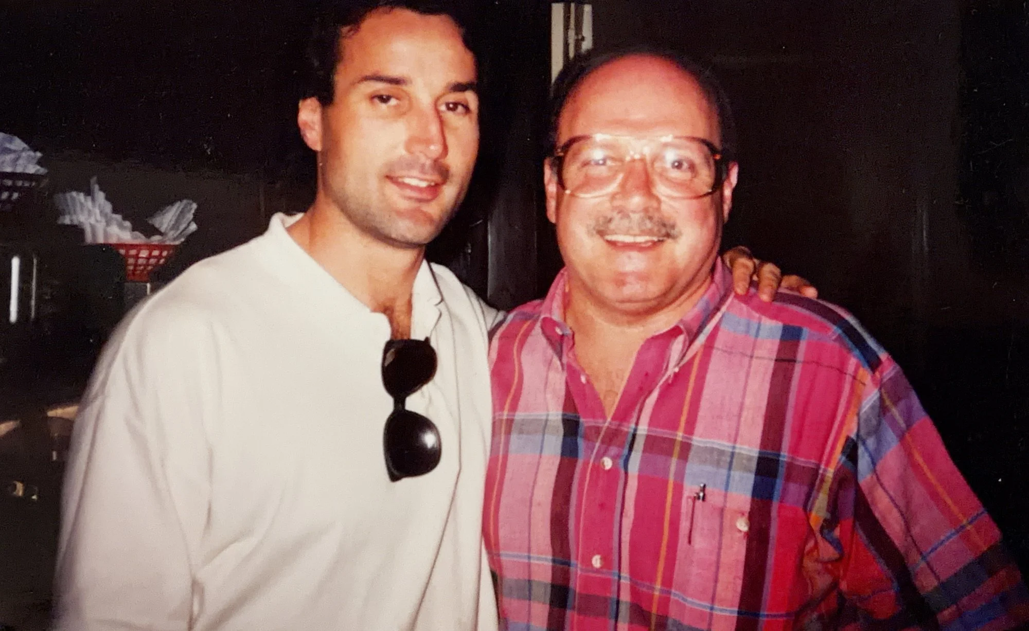 Saloon founder Jim Sheppard posing arm in arm with Penguins Hall of Fame defenseman Paul Coffey at The Saloon, early 1990s