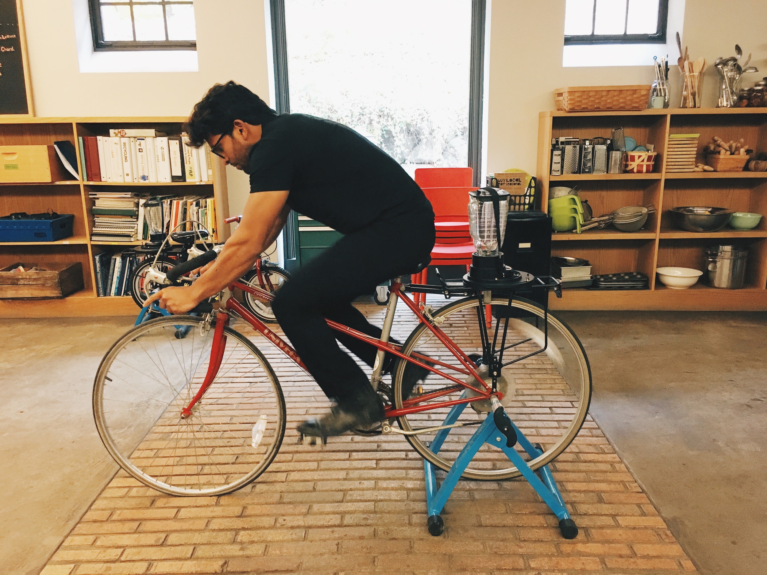 sal riding a bicycle retrofitted with a blender.