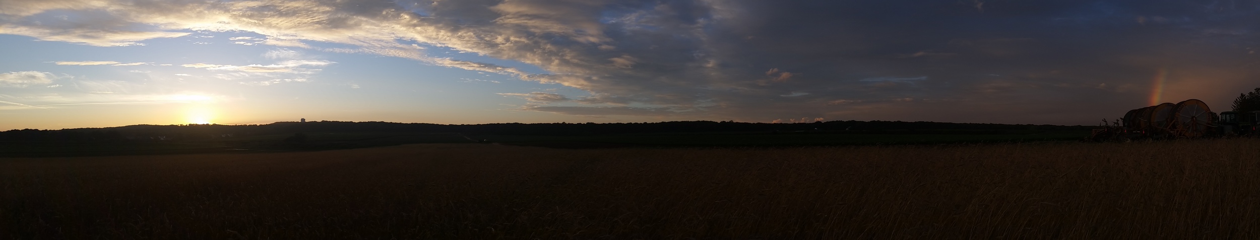 Sunset and rainbow simutaineously over the farm. Father's Day, 2015.