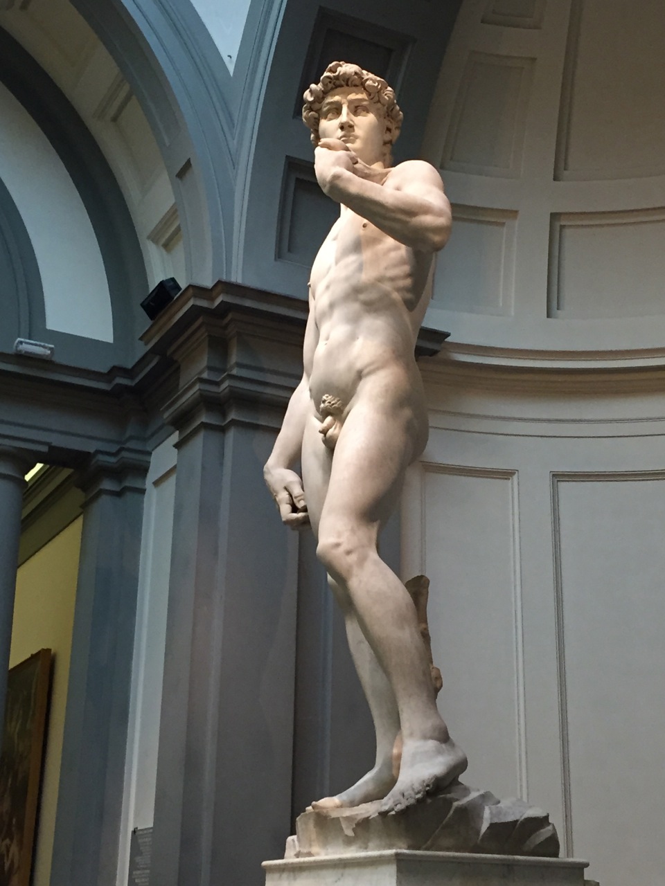 Michelangelo's statue of David in Florence, with the Biblical David preparing to slay Goliath with a slingshot.