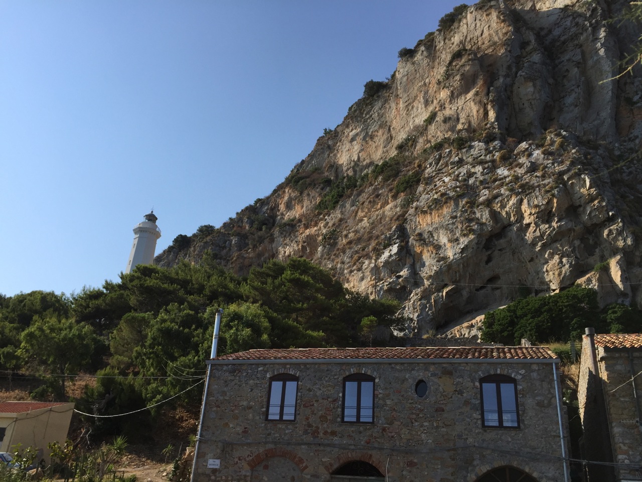 The city of Cefalu is nestled in between the rocky cliffs above and the Tyhhrenian seacoast.
