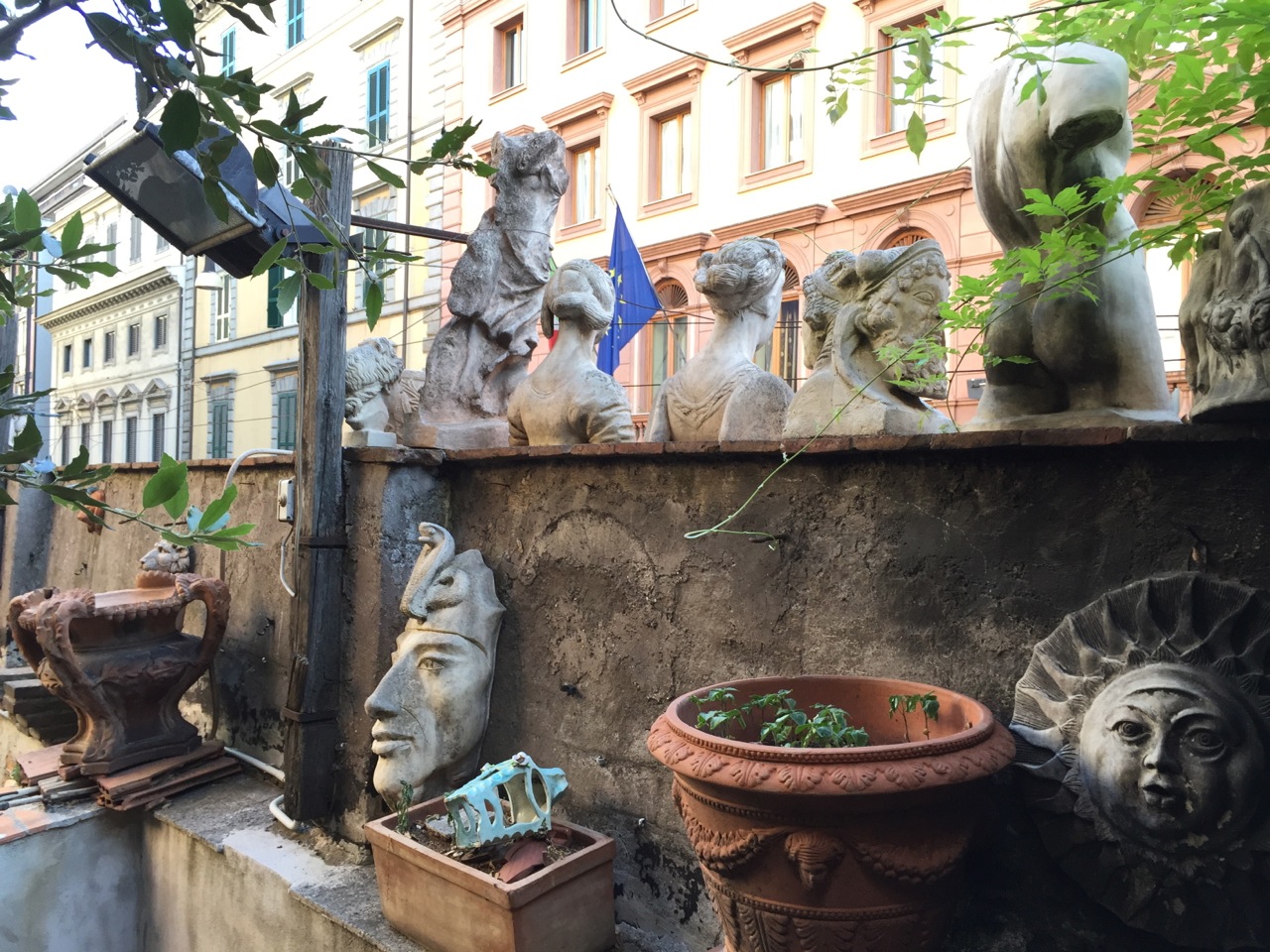 A cafe with a walled garden in Rome.