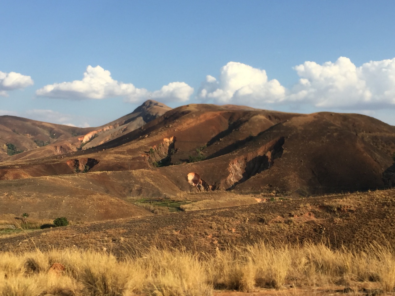 Deep gullies on eroding hillsides on denuded hillsides along the road from Antananarivo to Morondava. The sediment is carried downward into the rivers.