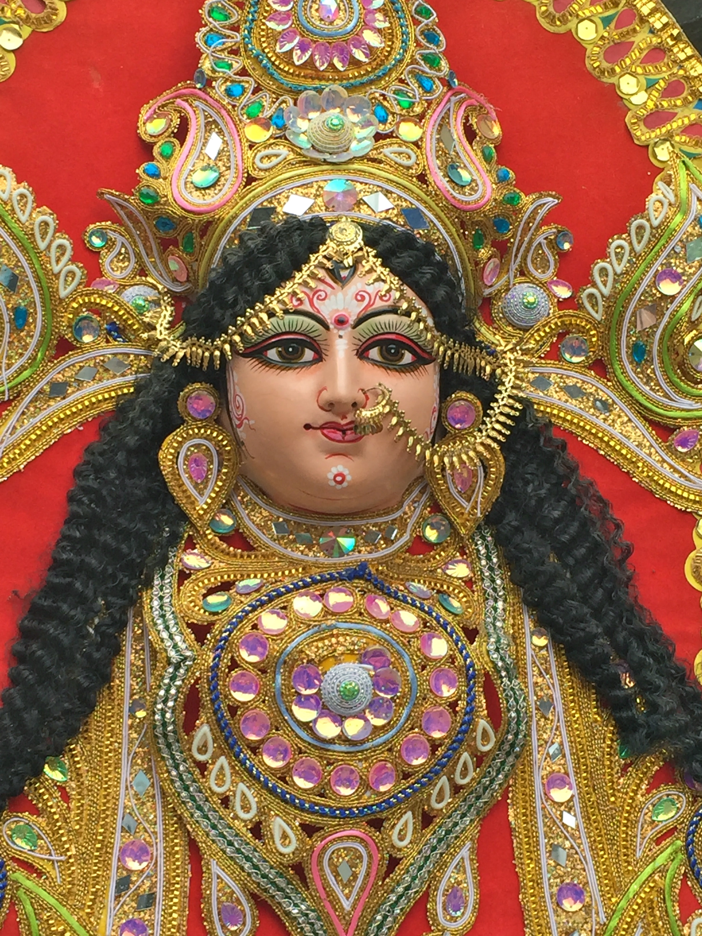 Statues and figurines are decked out in the most brilliant colors and jewels.