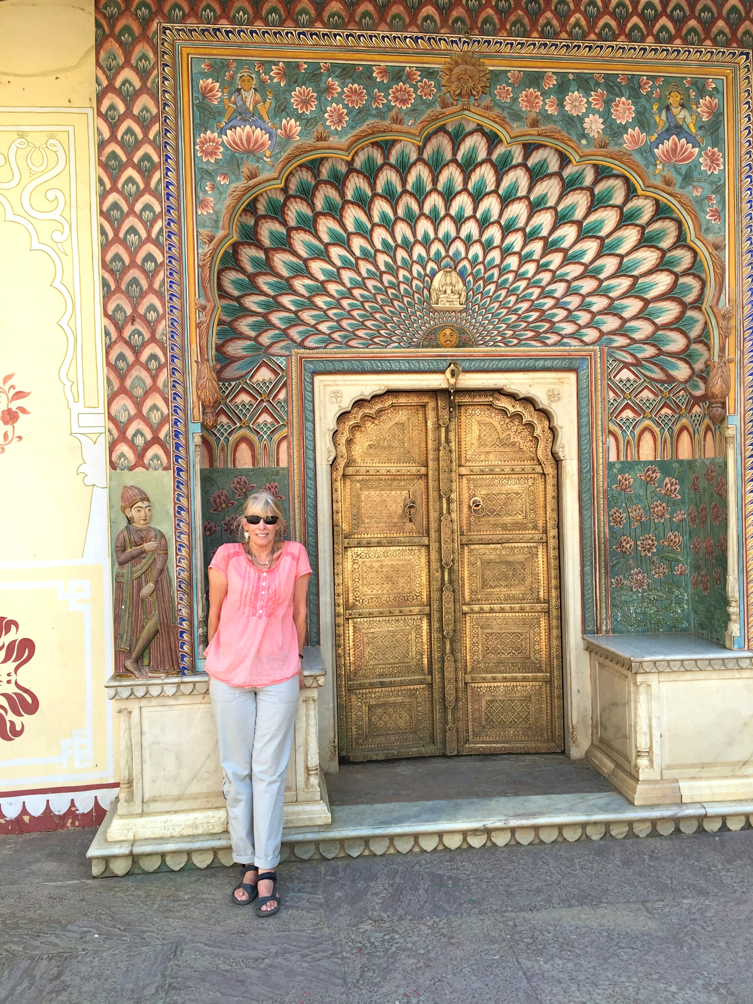 This is me standing in front of some doors from a courtyard at the City Palace of Jaipur.