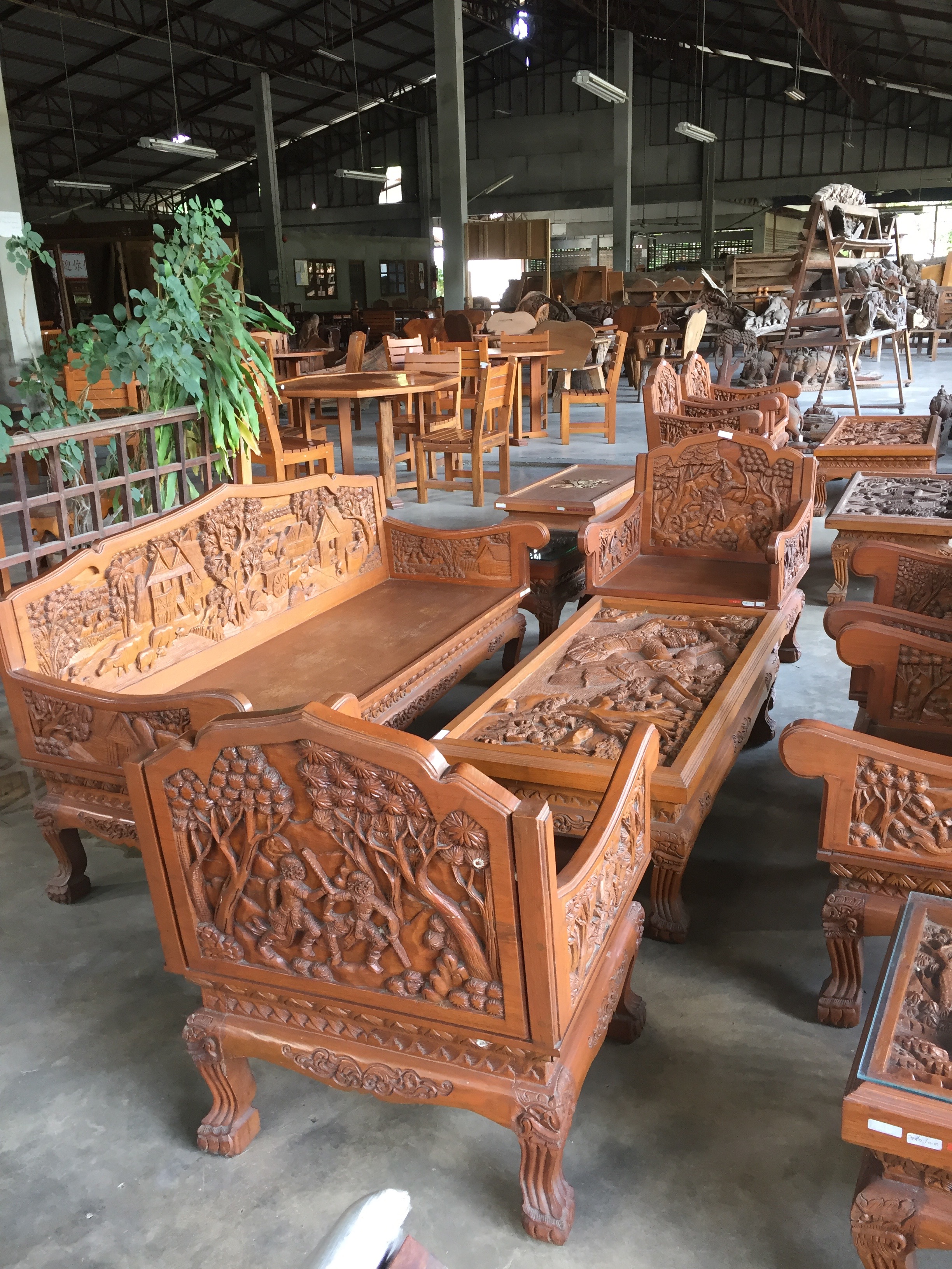 Teak warehouse in Chang Mai where you can buy big, ornate furniture made from teak at discount rates. US tourists are the biggest consumers, according to warehouse personnel.