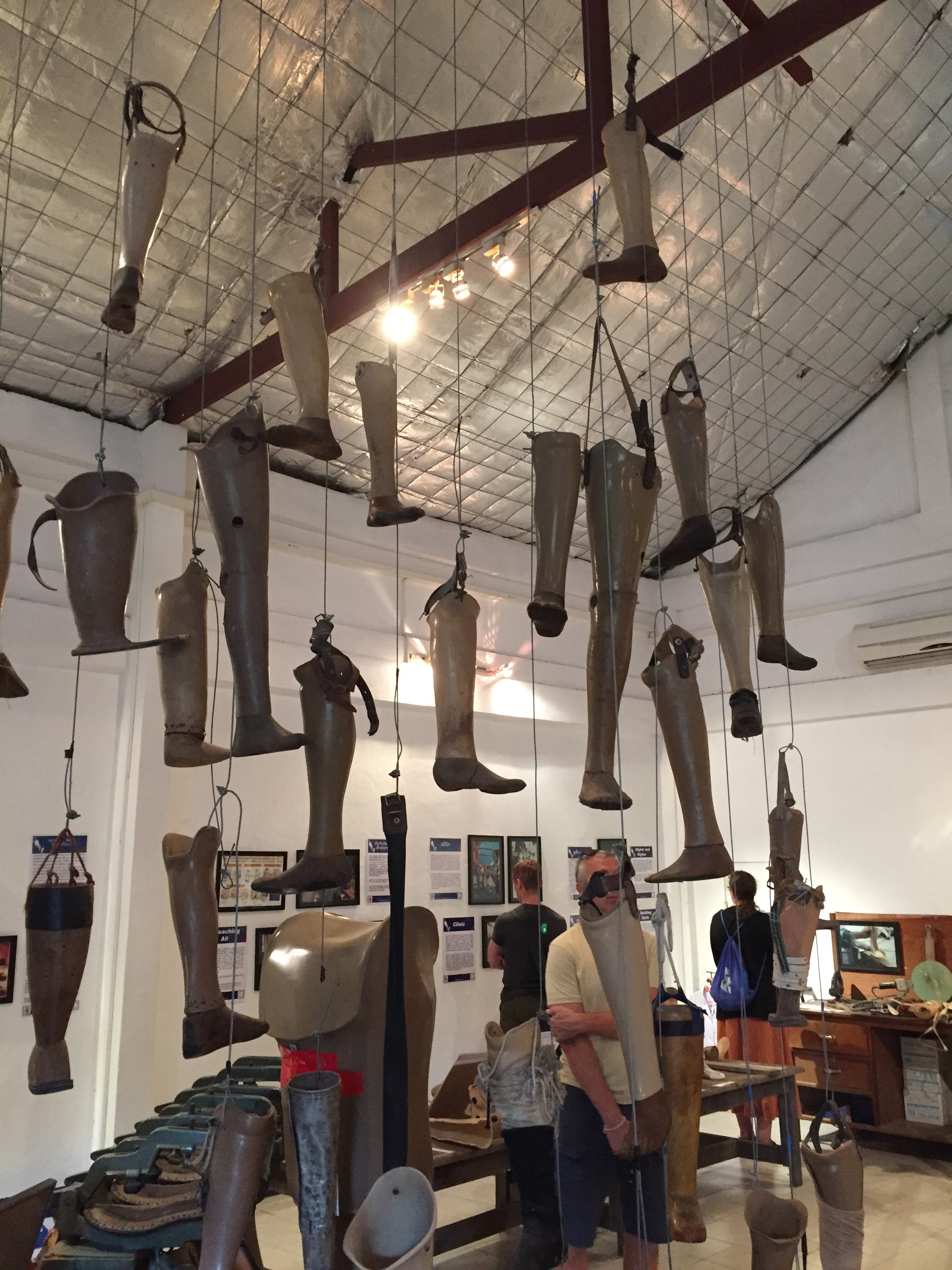 The COPE visitor center in Vientiane, Laos educates the public about the continuing threat of unexploded ordnance in Laos. COPE also trains local staff to manufacture prosthetic limbs, such as those pictured above, for survivors of exploding bombs.