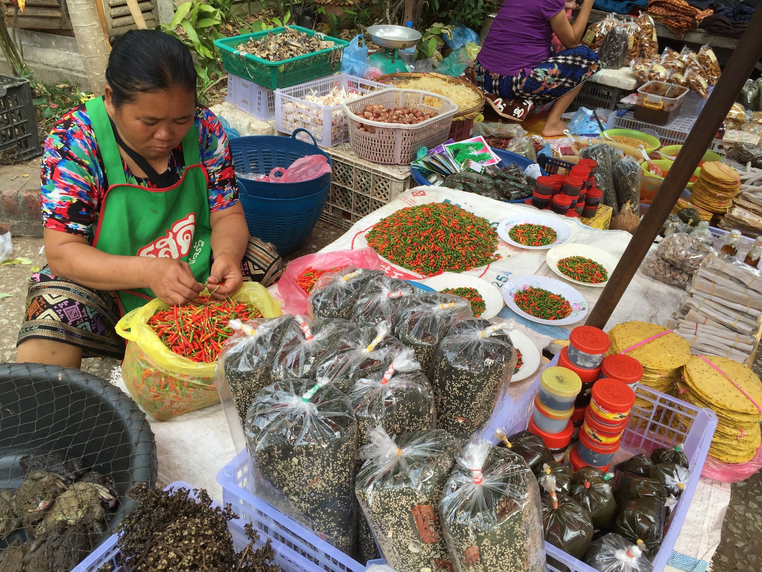 Colorful chilis and legumes are everywhere at the street market in Luang Prabang.