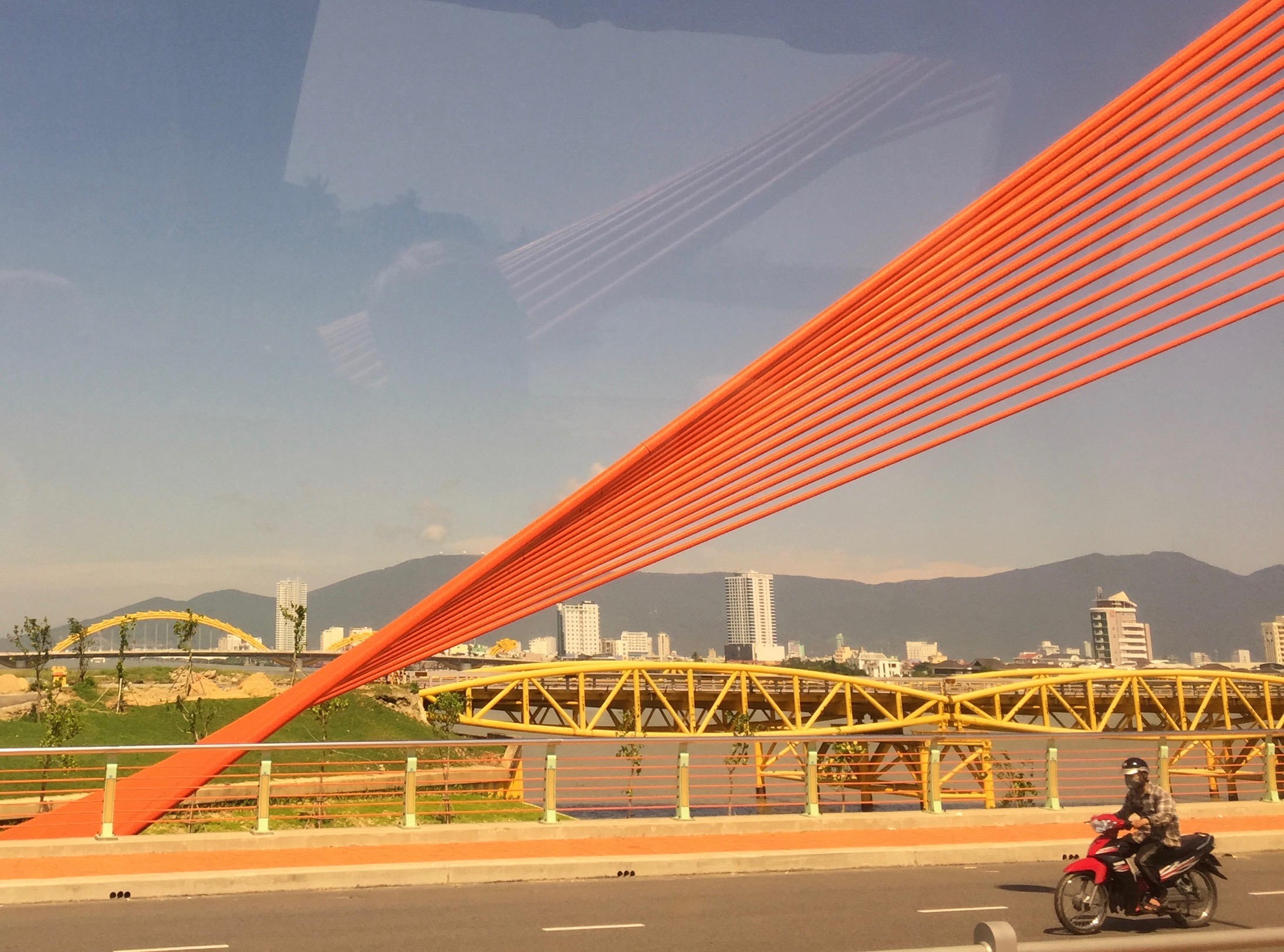 Crossing a bridge into Da Nang, now highly developed with beach resorts.