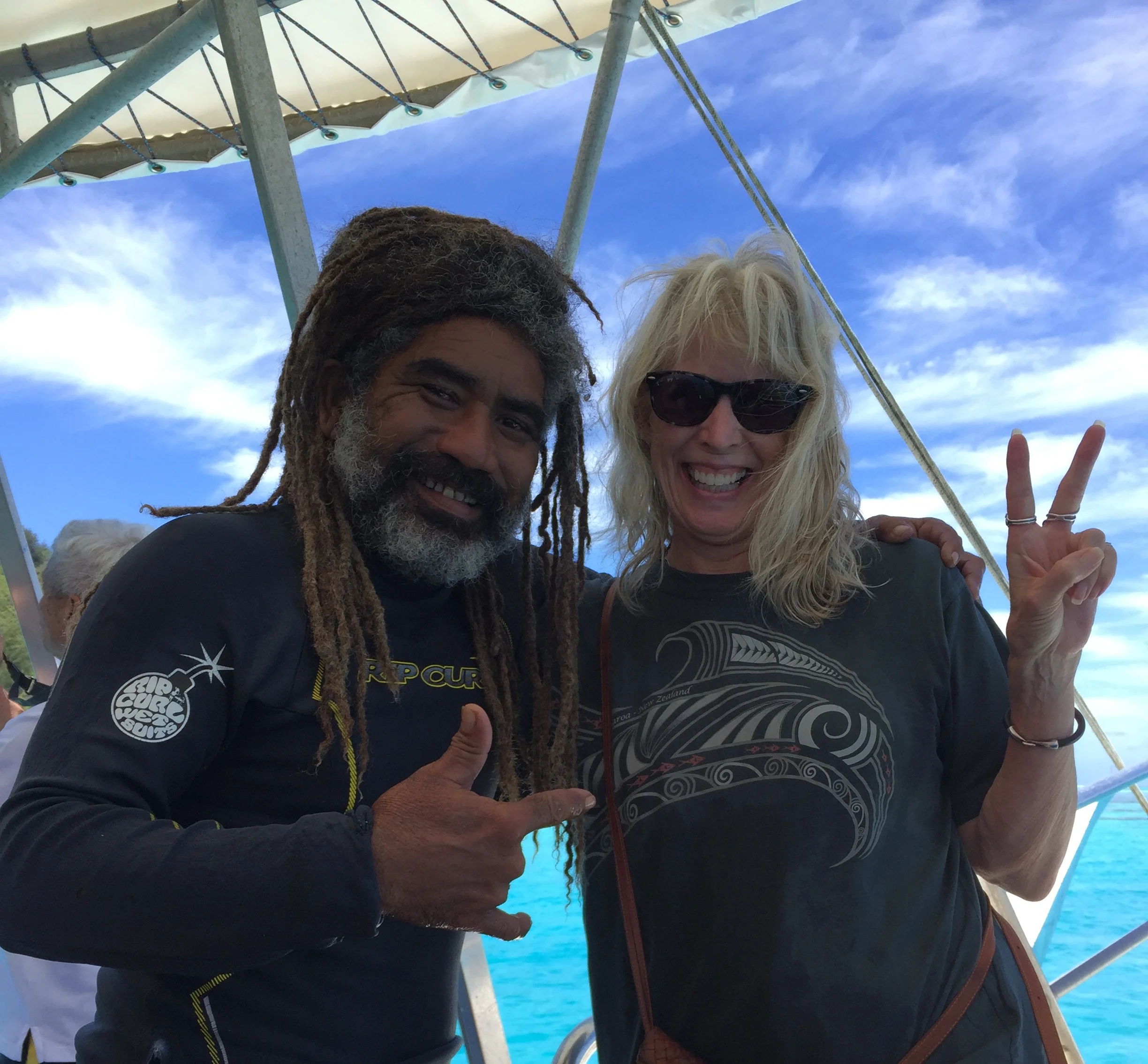 Our guide and me after enjoying a wonderful time swimming with the sharks and rays.