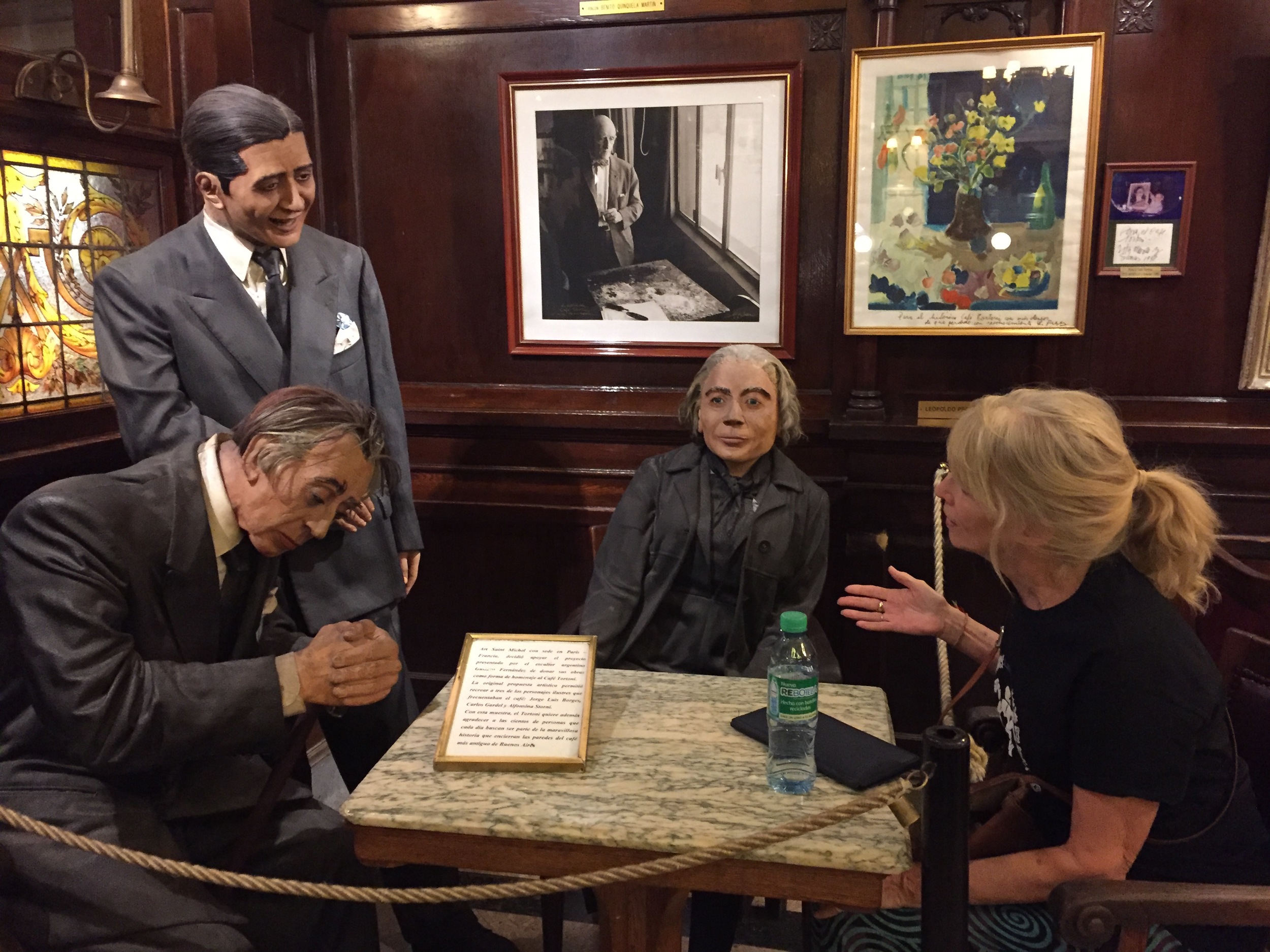 My fantasy conversation with poet Jorge Luis Borges, tango legend Carlos Gardel and poet Alfonsina Storni at the Gran Cafe Tortoni in Buenos Aires. (They are actually wax figures memorializing these great figures who used to hang out at the cafe.