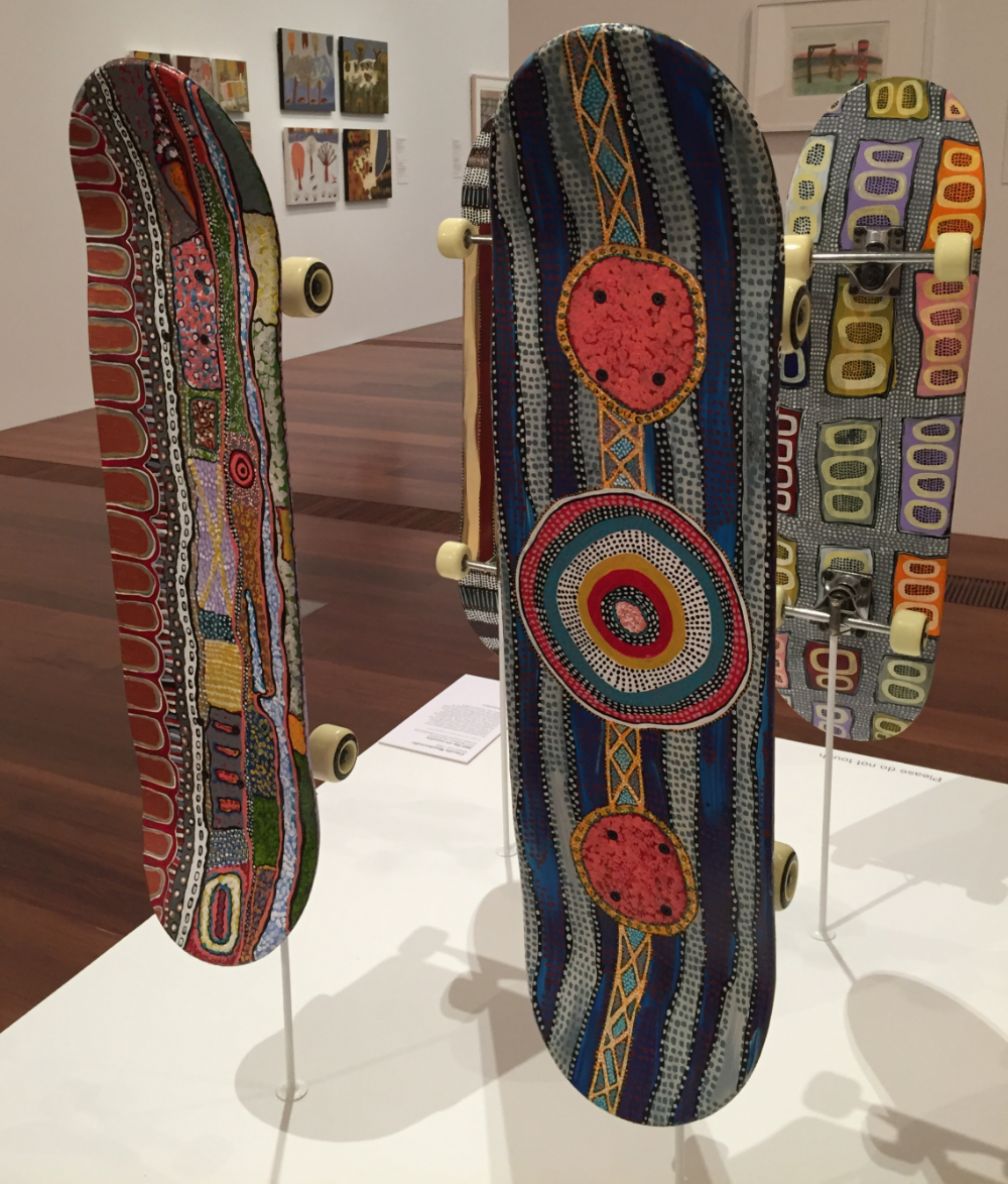 "360 degree spin on Country," skateboards painted by Claudia Moodoonuthi, on display at the National Gallery in Melbourne, Australia