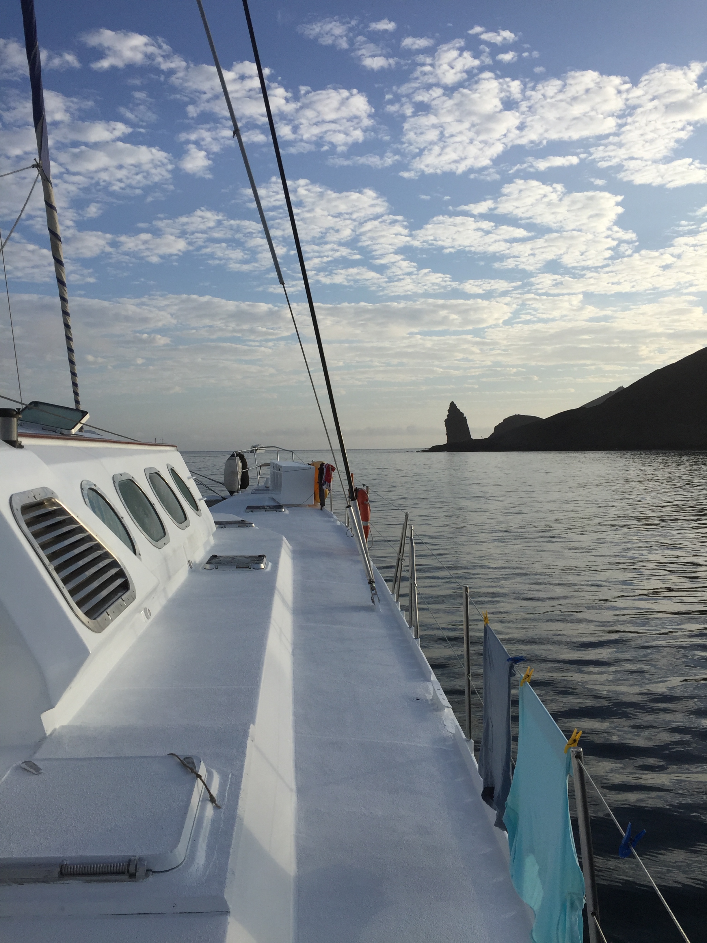 Approaching an eroded volcanic rock on the coast of Santiago Island.